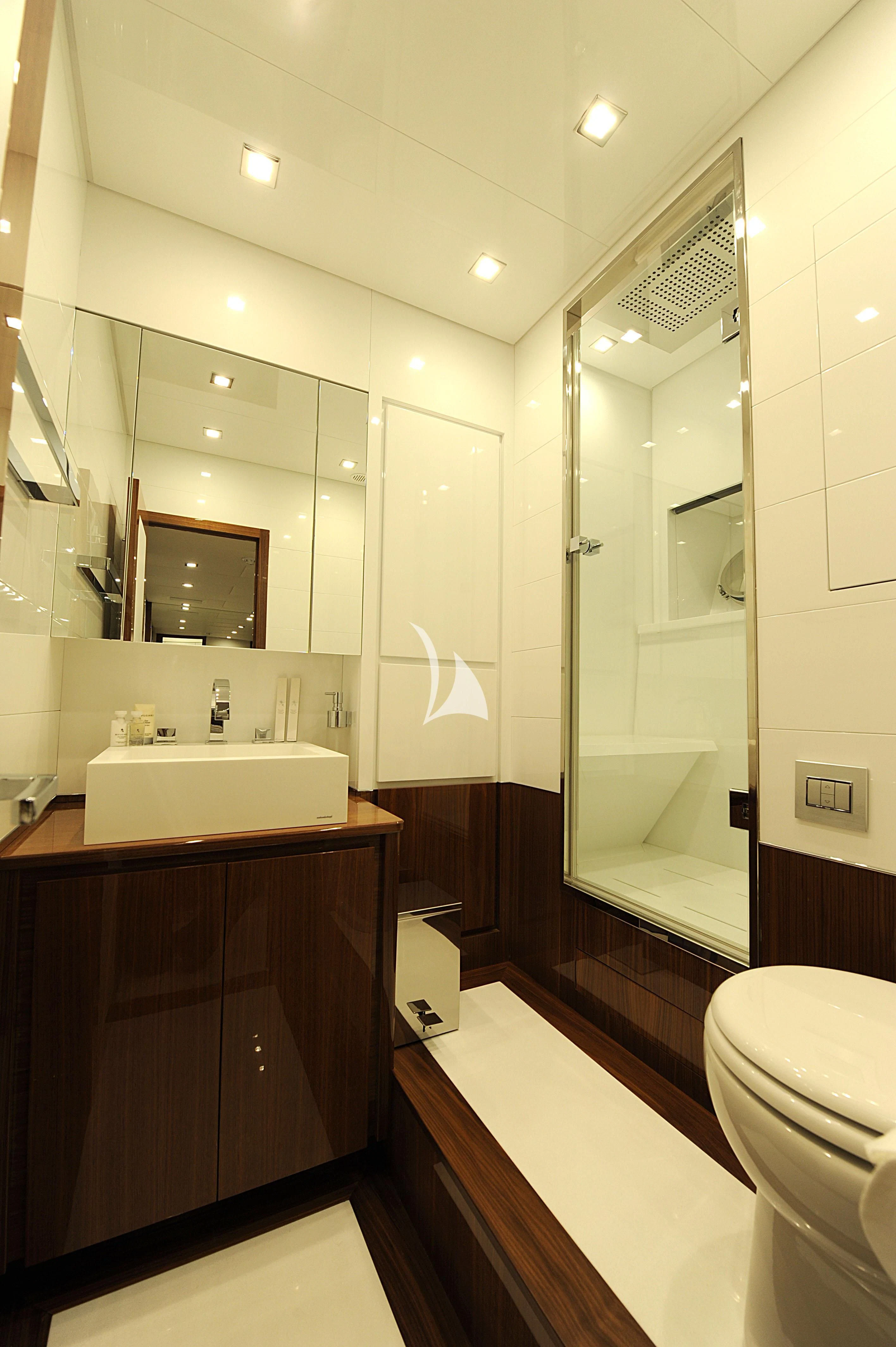 a bathroom with a large mirror aboard PHOENICIAN Yacht for Sale
