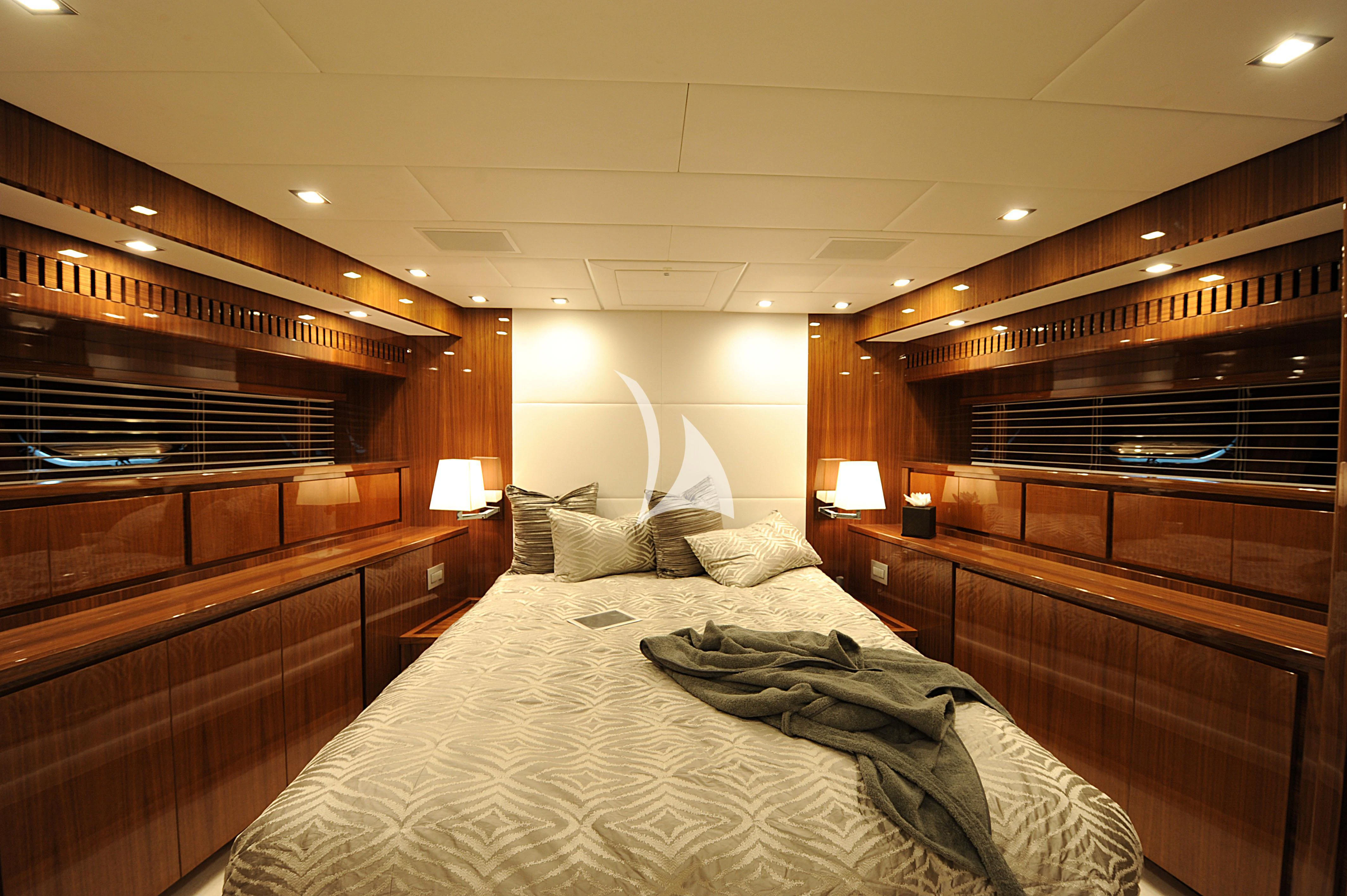 a room with wooden bunk beds aboard PHOENICIAN Yacht for Sale