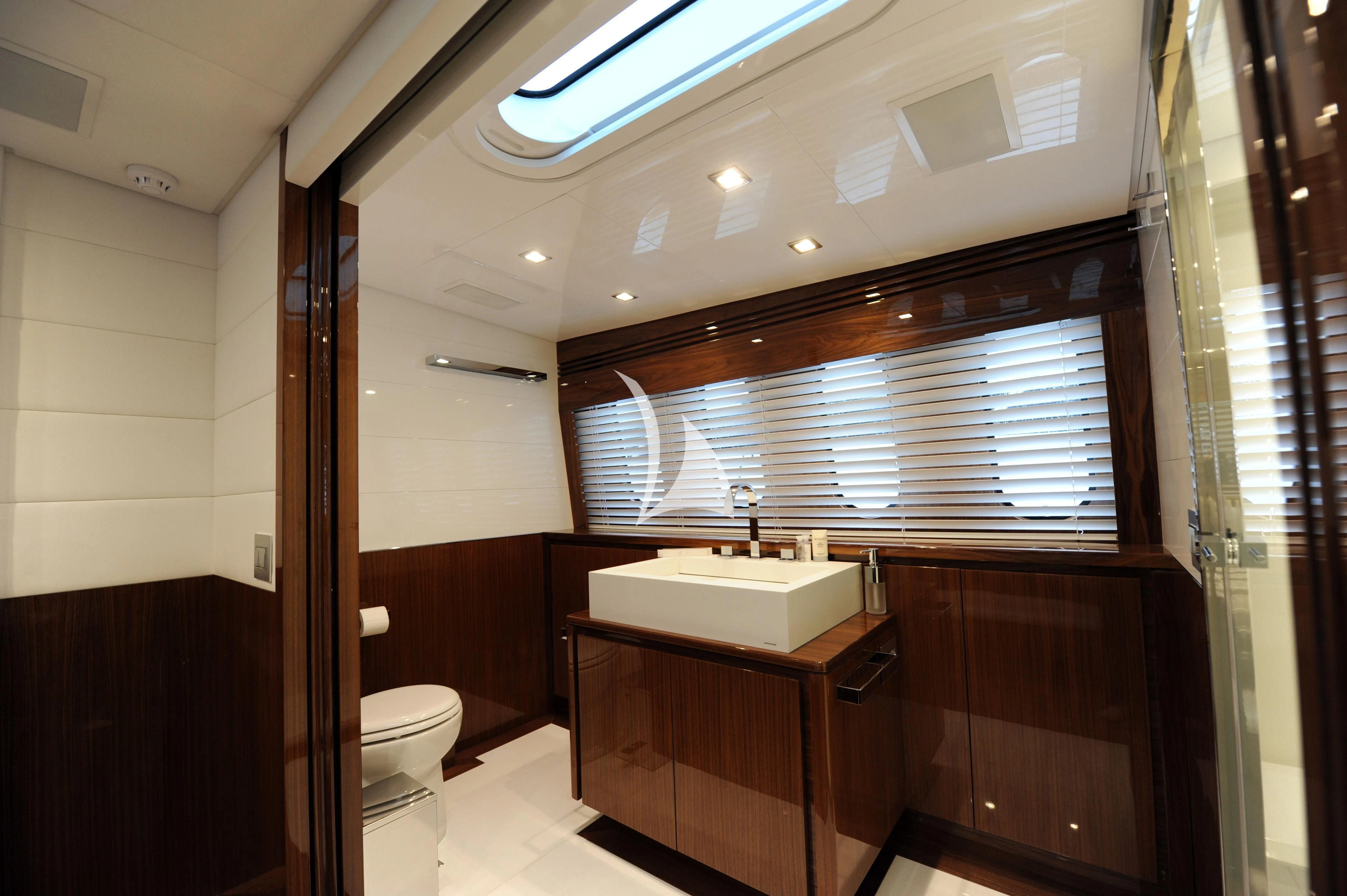 a bathroom with a sink and a toilet aboard PHOENICIAN Yacht for Sale
