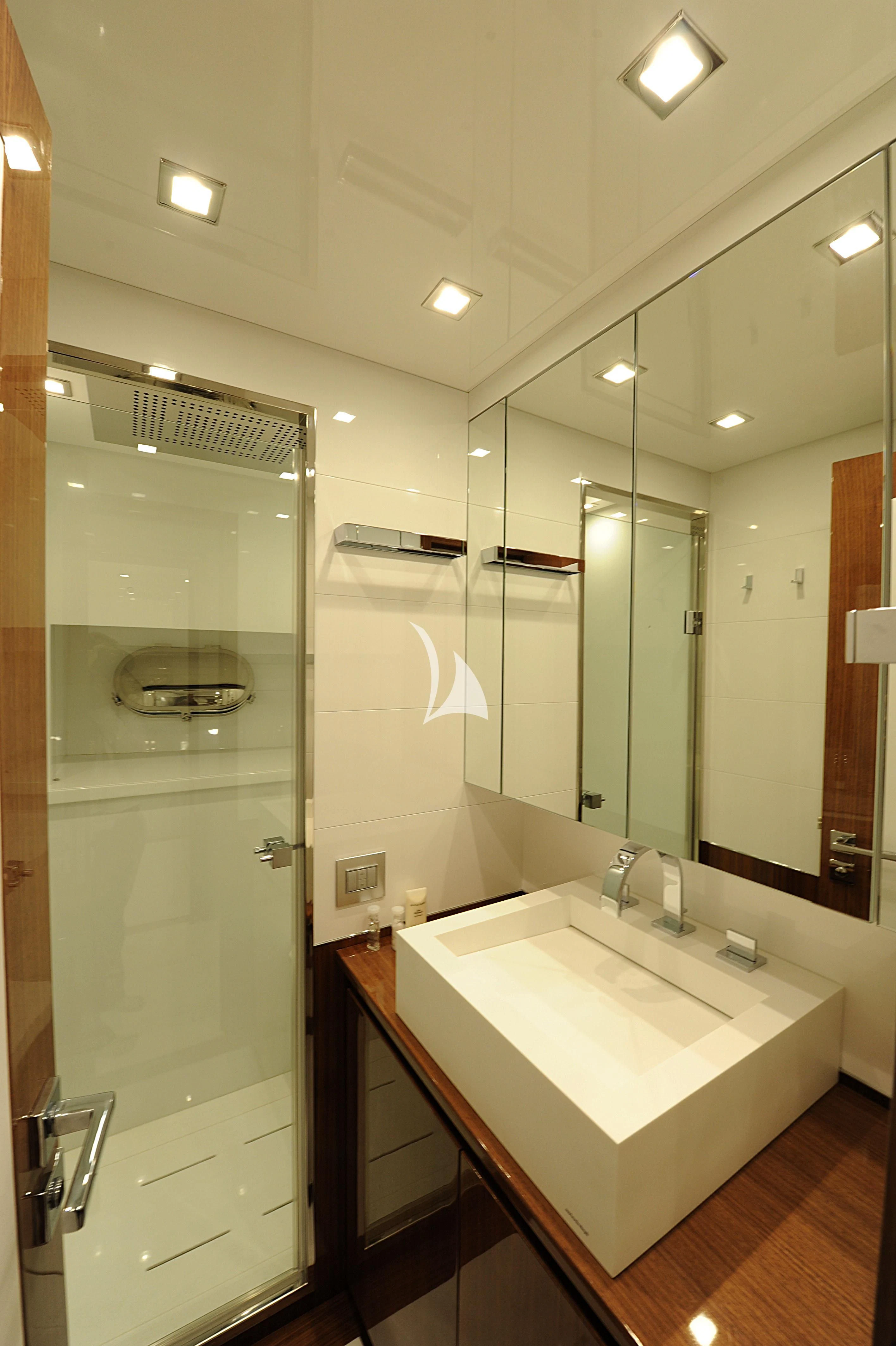 a bathroom with a large mirror aboard PHOENICIAN Yacht for Sale