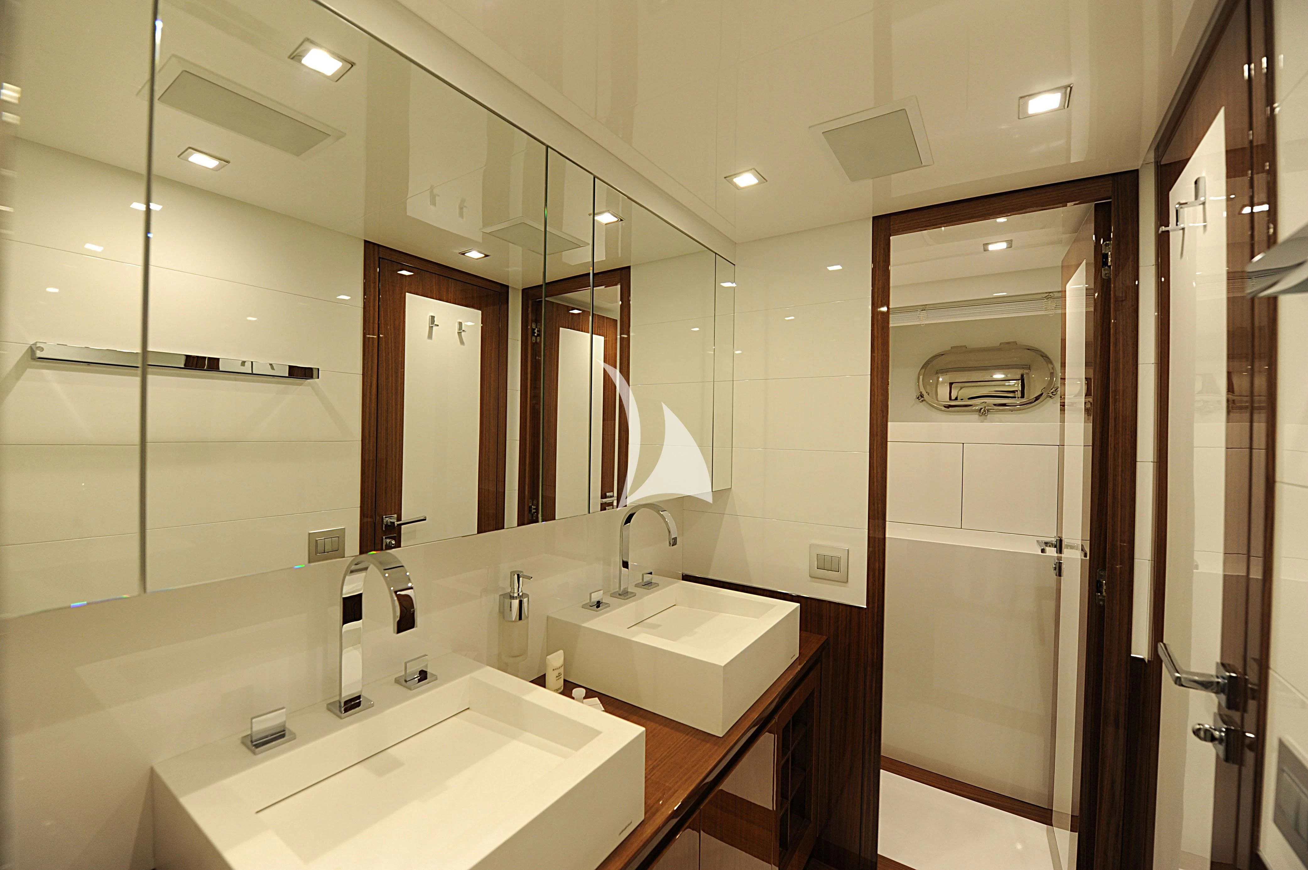 a bathroom with sinks and mirrors aboard PHOENICIAN Yacht for Sale
