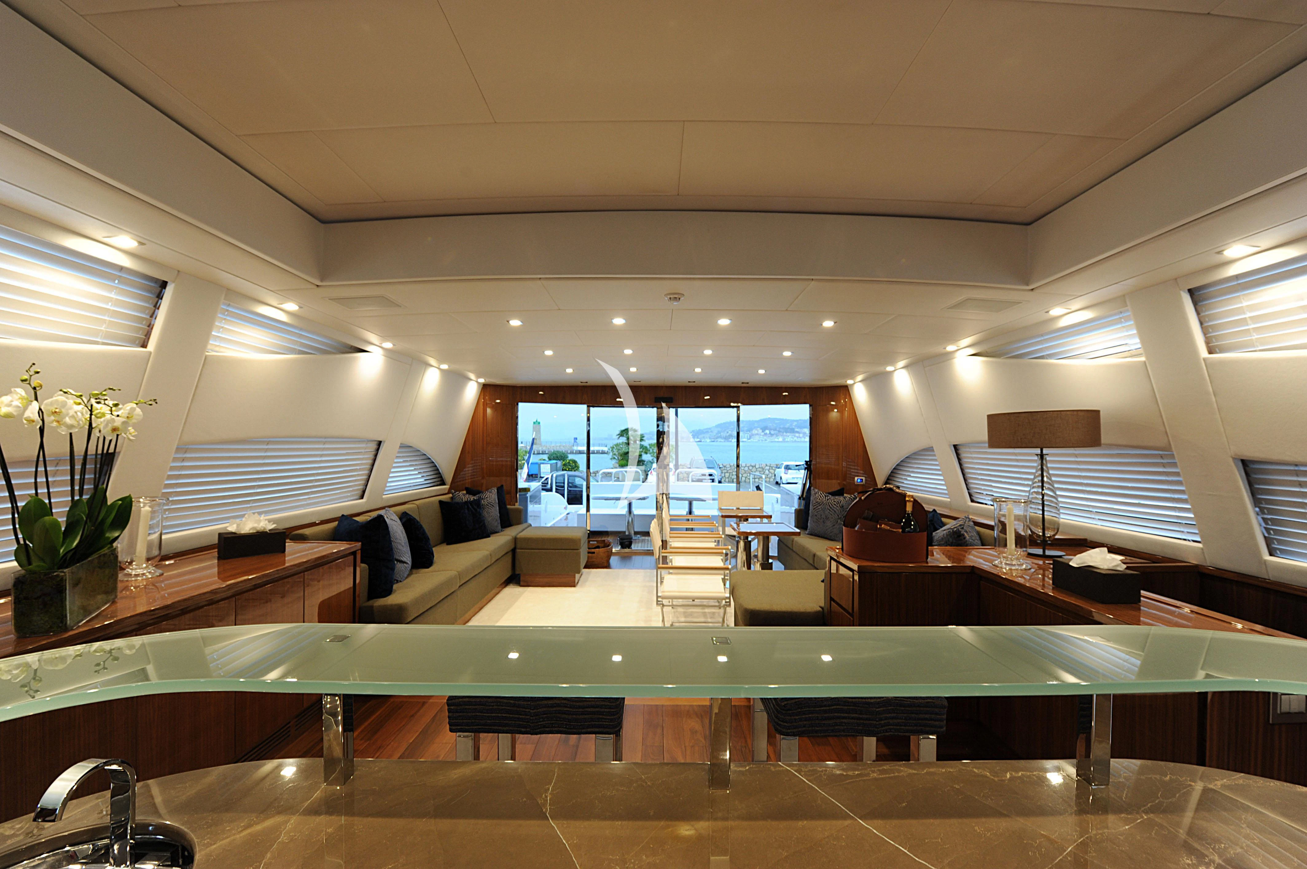 a room with a couch and a table aboard PHOENICIAN Yacht for Sale
