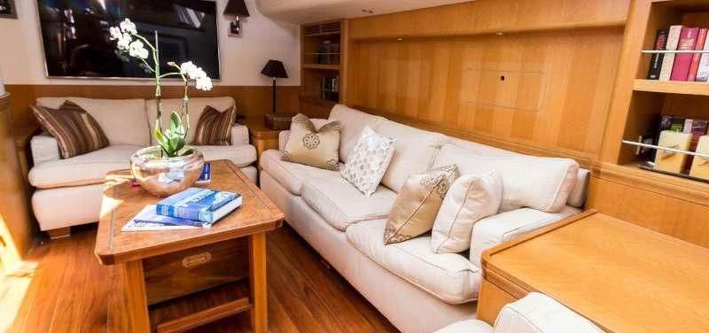 a living room with a couch and a coffee table aboard MARGARET ANN Yacht for Sale