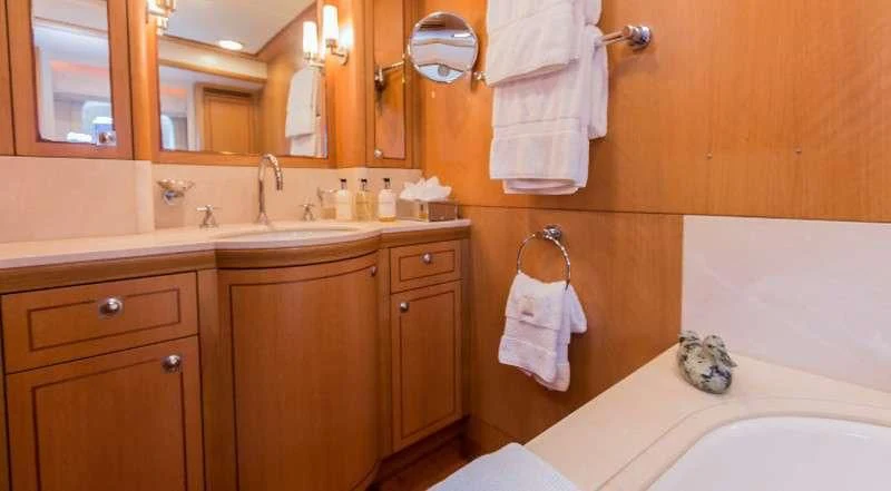 a bathroom with a large mirror aboard MARGARET ANN Yacht for Sale