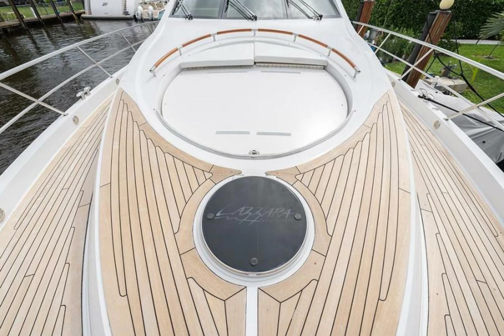 a white circular object on a wooden deck aboard LATITUDE Yacht for Sale