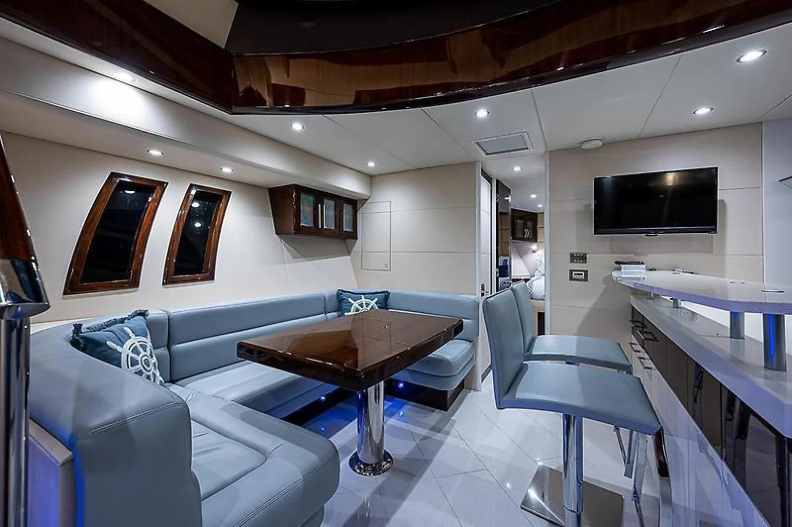a living room with a couch and a table aboard LATITUDE Yacht for Sale