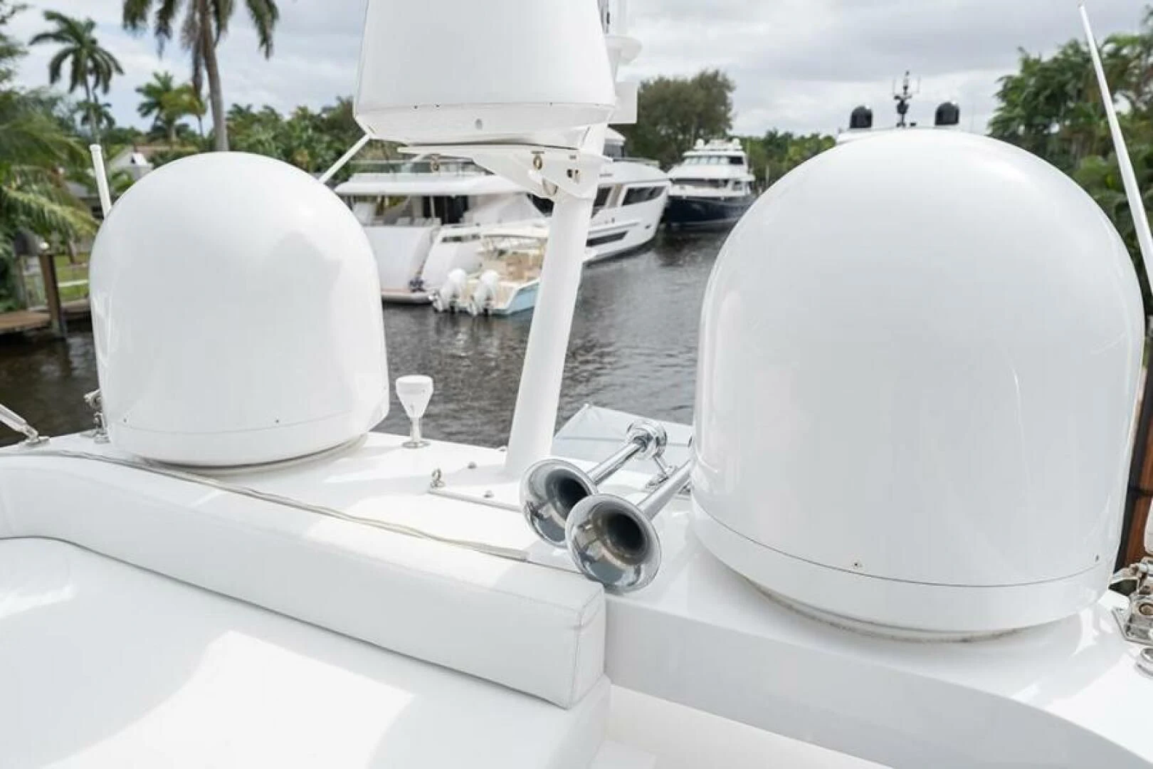 a white boat with a white circle on it aboard LATITUDE Yacht for Sale