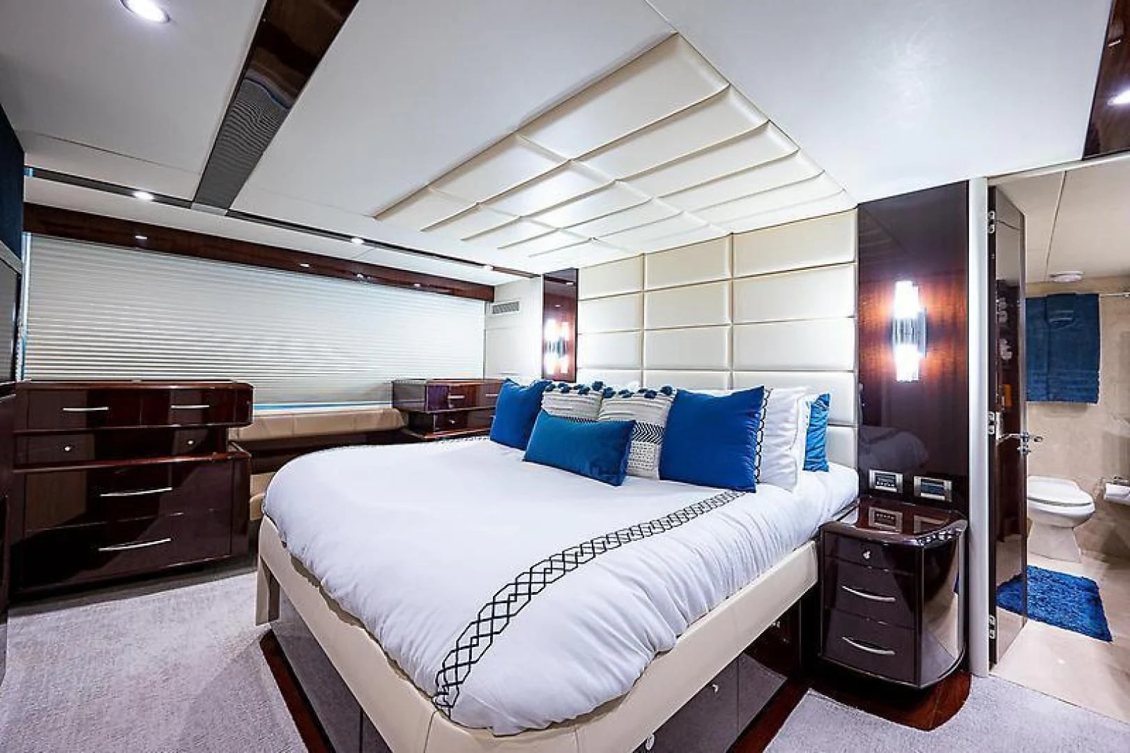 a large bedroom with a bed aboard LATITUDE Yacht for Sale