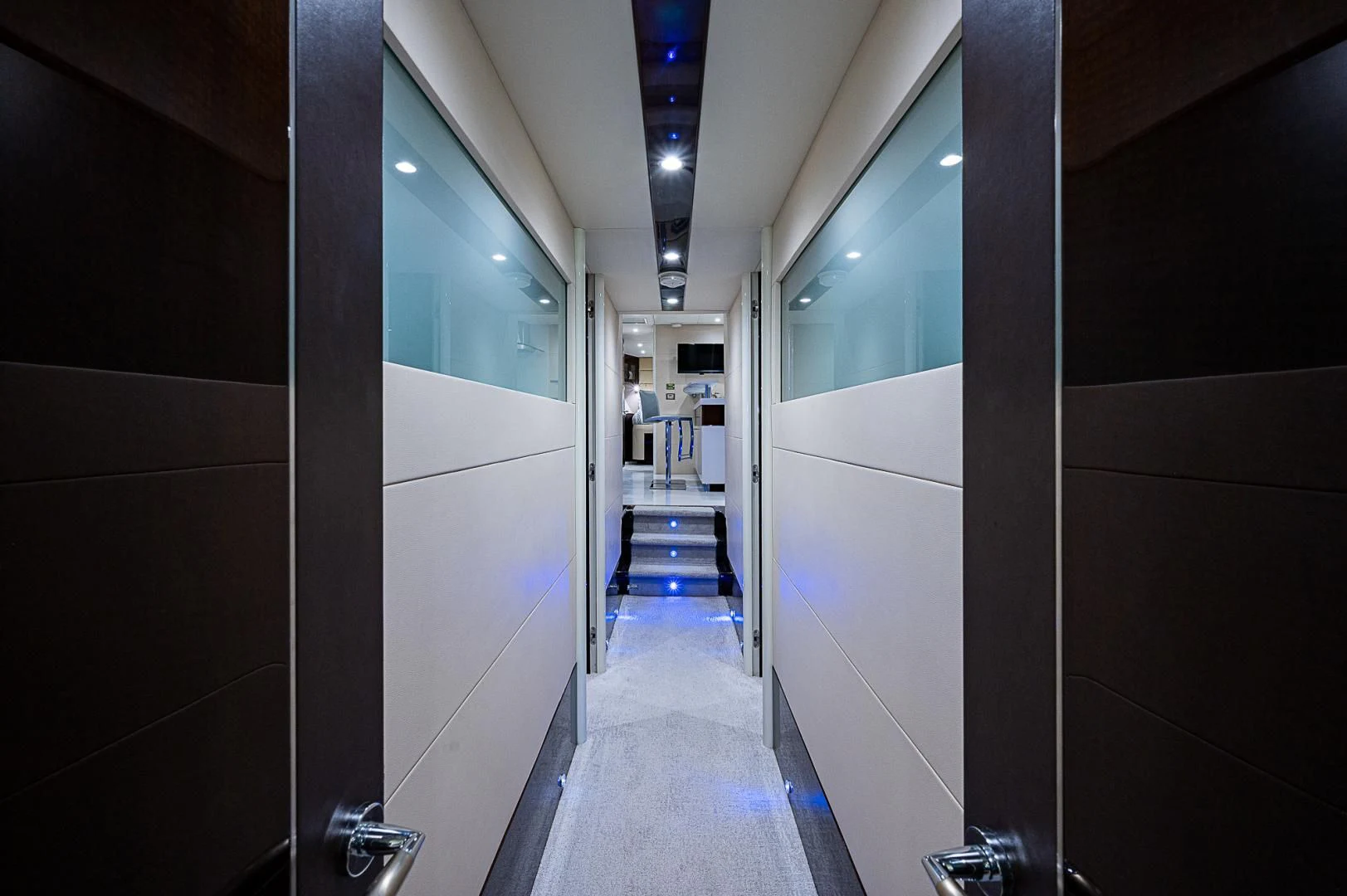 a hallway with a few people aboard LATITUDE Yacht for Sale