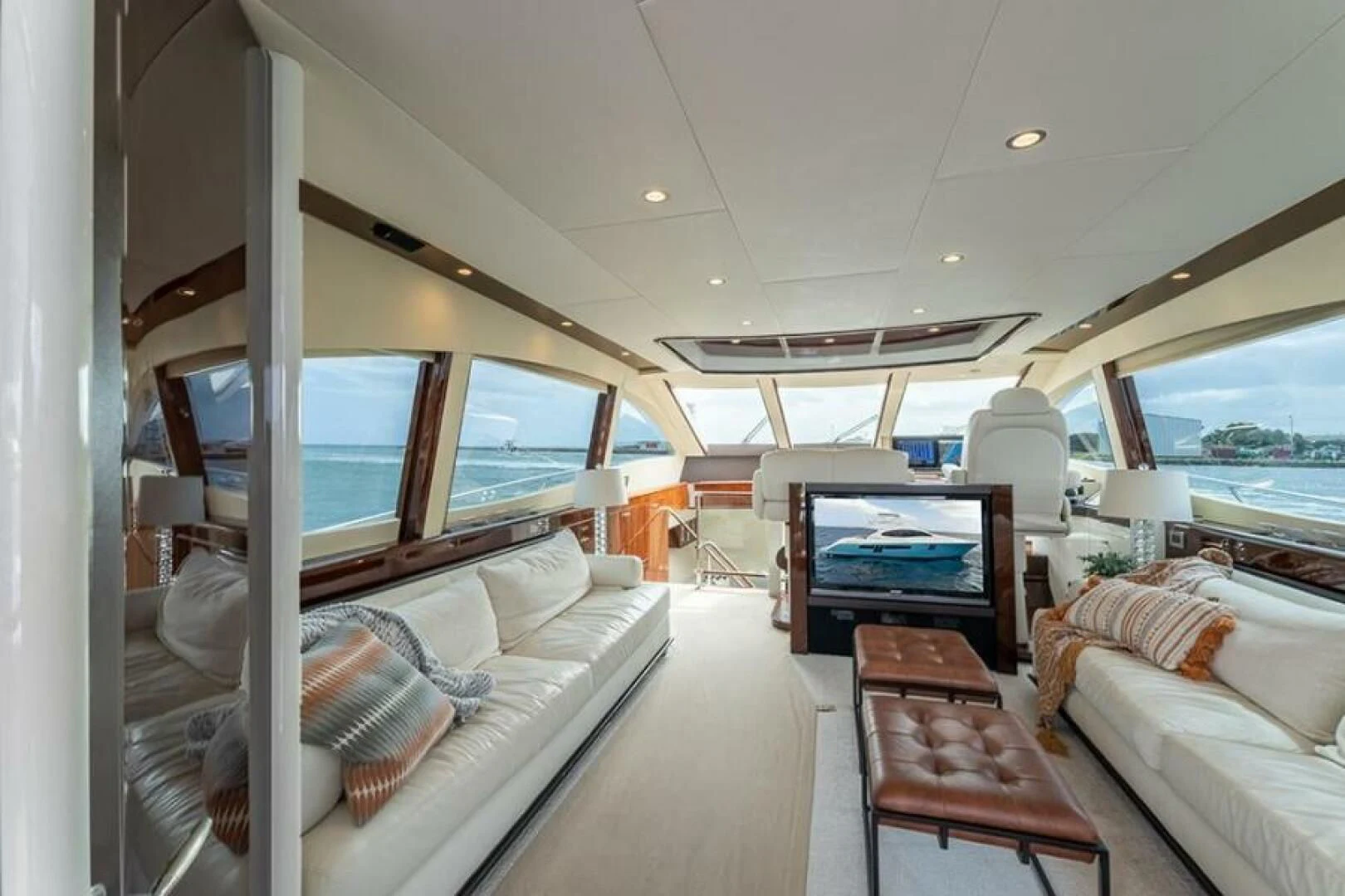 a boat with a couch and a table in it aboard LATITUDE Yacht for Sale