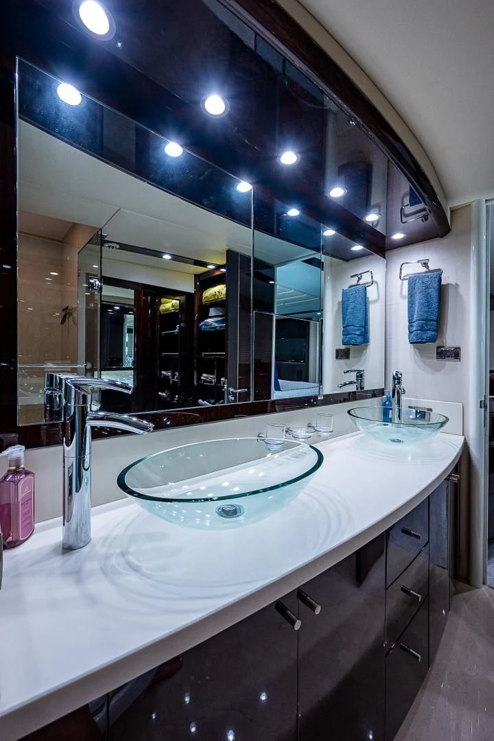 a bathroom with a large mirror aboard LATITUDE Yacht for Sale