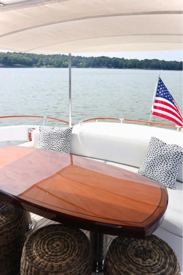 a boat with a flag on the front aboard LATITUDE Yacht for Sale