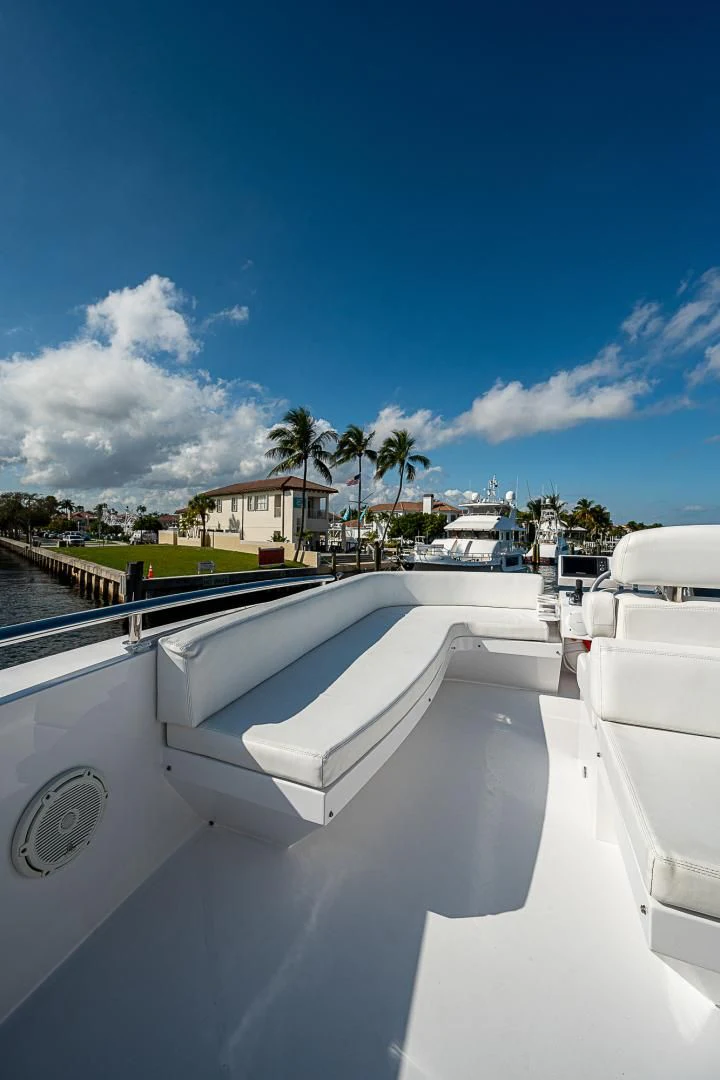 a white boat on a deck aboard LATITUDE Yacht for Sale