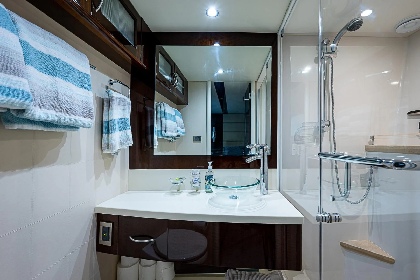 a bathroom with a large mirror aboard LATITUDE Yacht for Sale