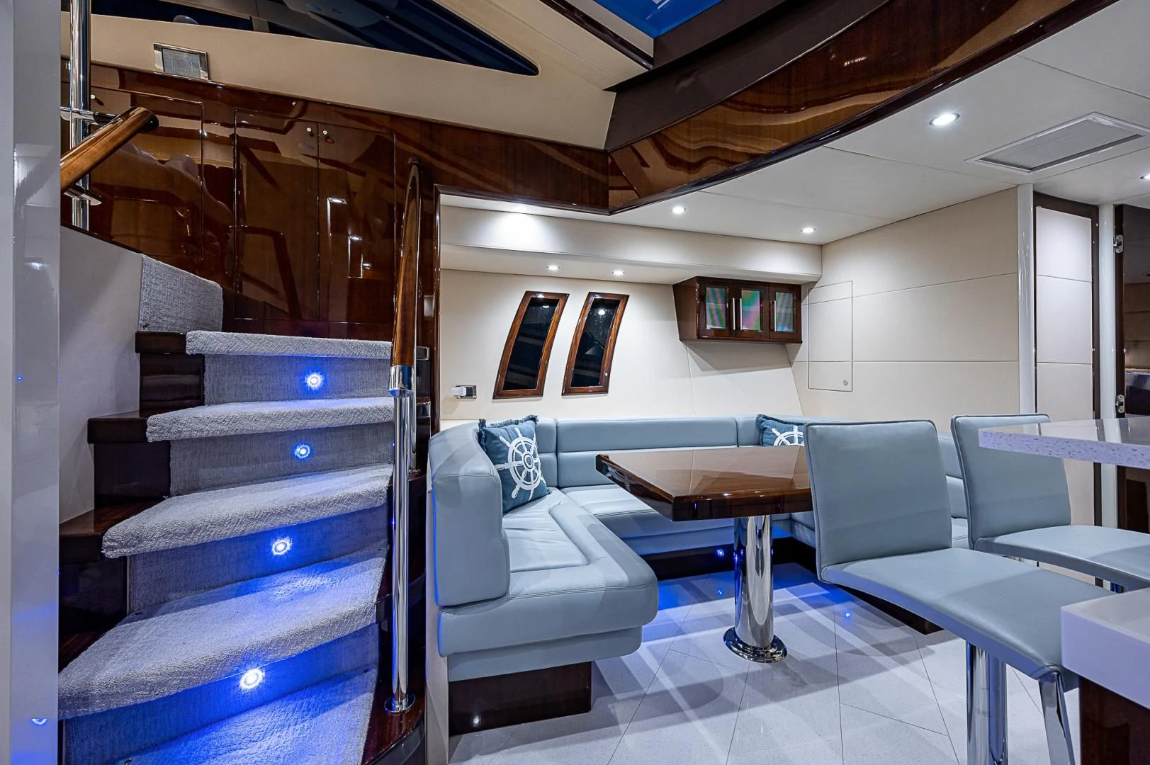 a room with a table and chairs aboard LATITUDE Yacht for Sale