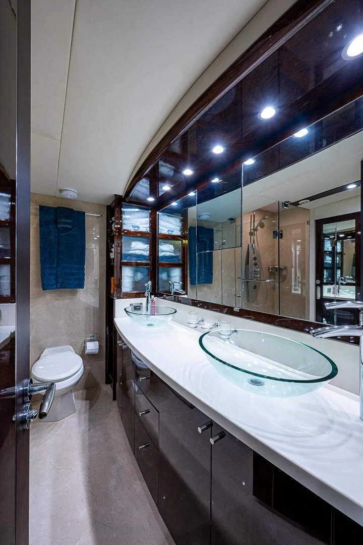 a bathroom with a large mirror aboard LATITUDE Yacht for Sale