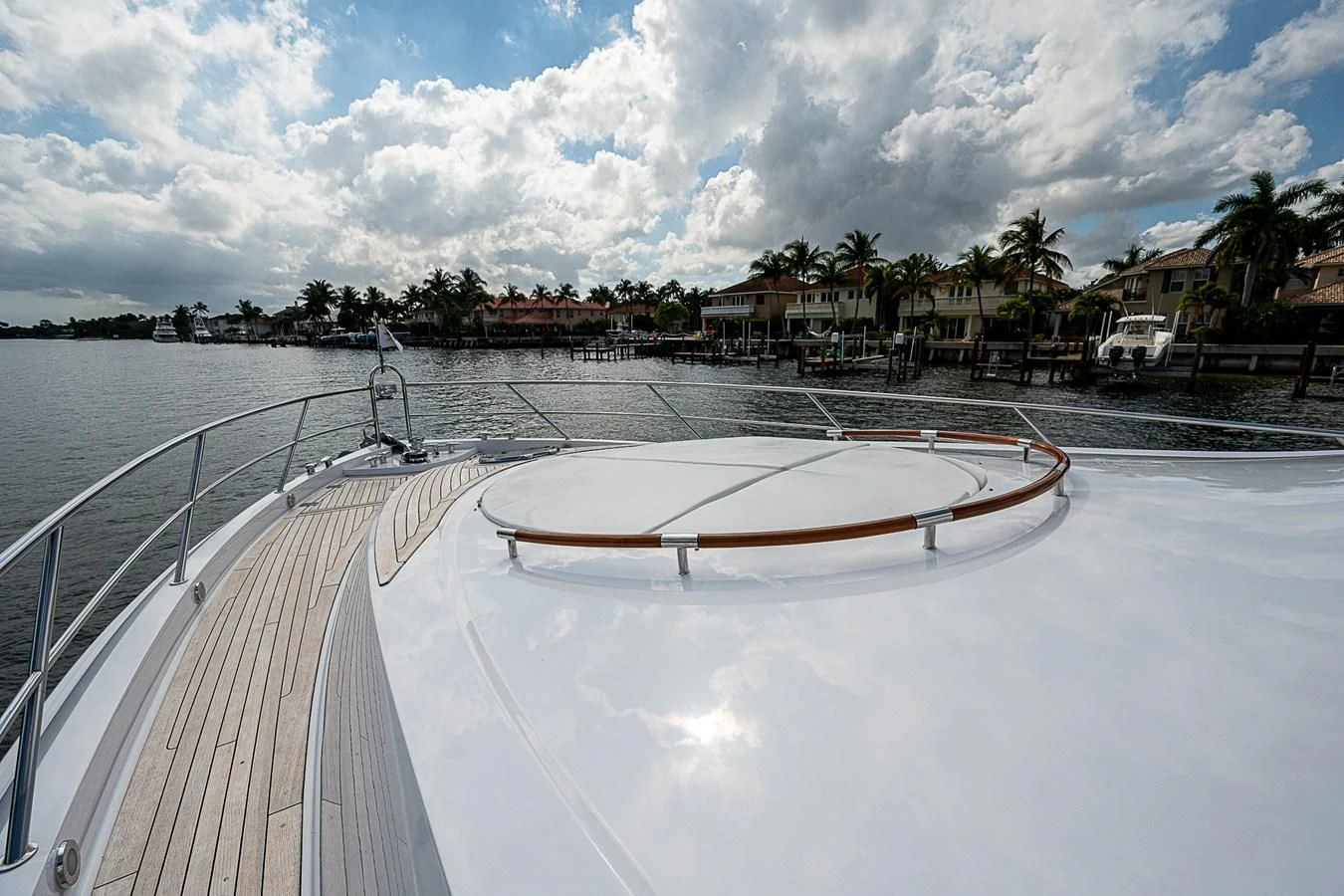 a white boat on a body of water aboard LATITUDE Yacht for Sale