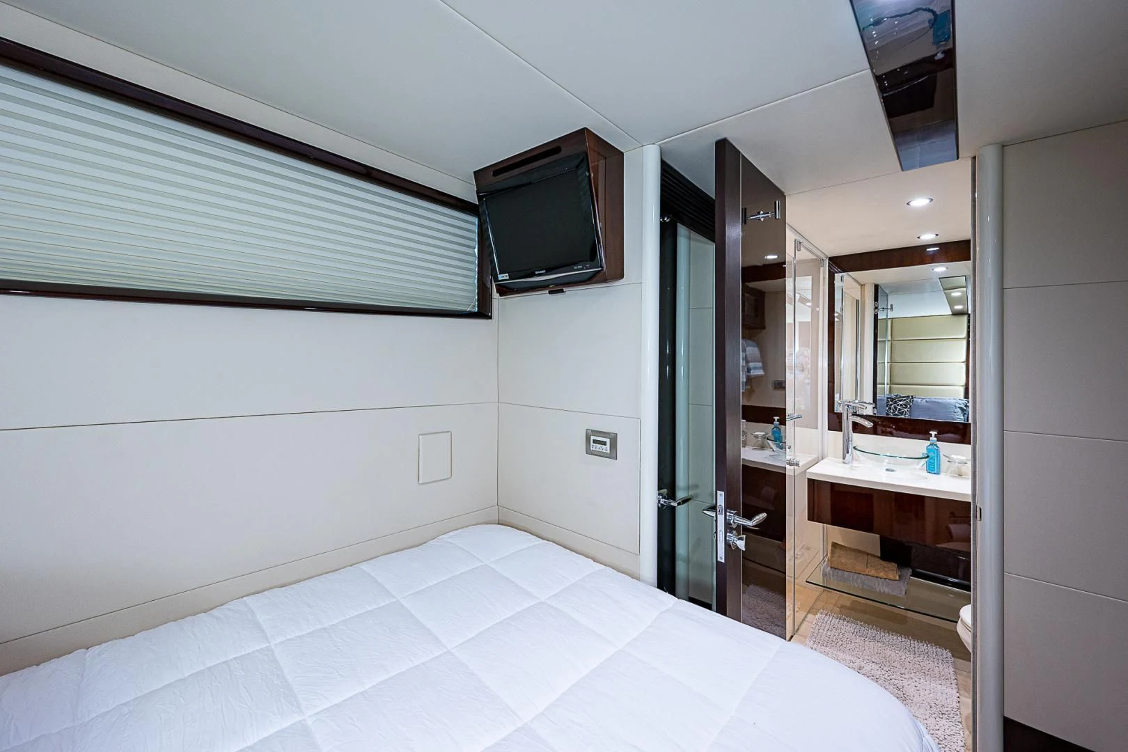 a bathroom with a large mirror aboard LATITUDE Yacht for Sale