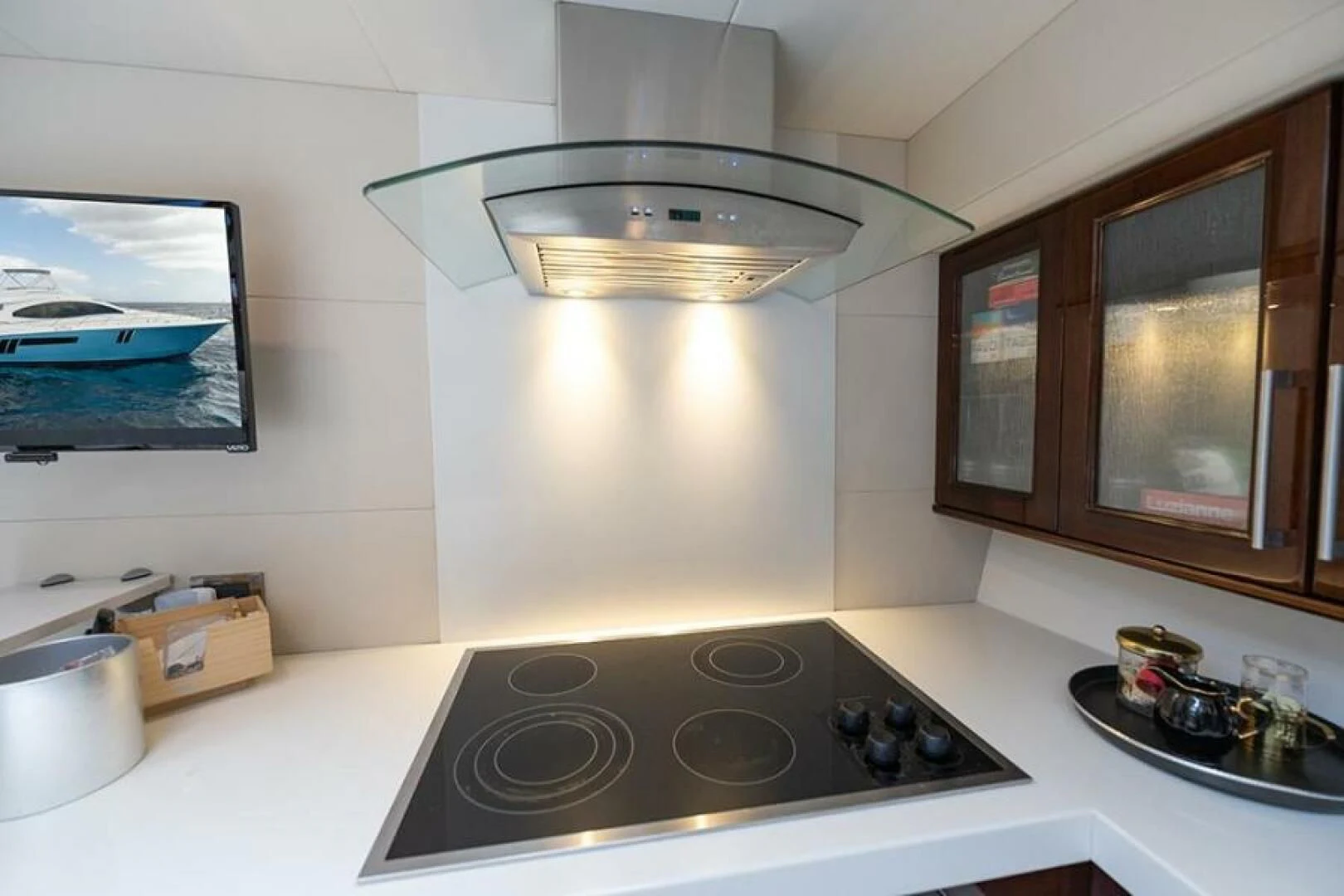 a kitchen with a stove and a light aboard LATITUDE Yacht for Sale