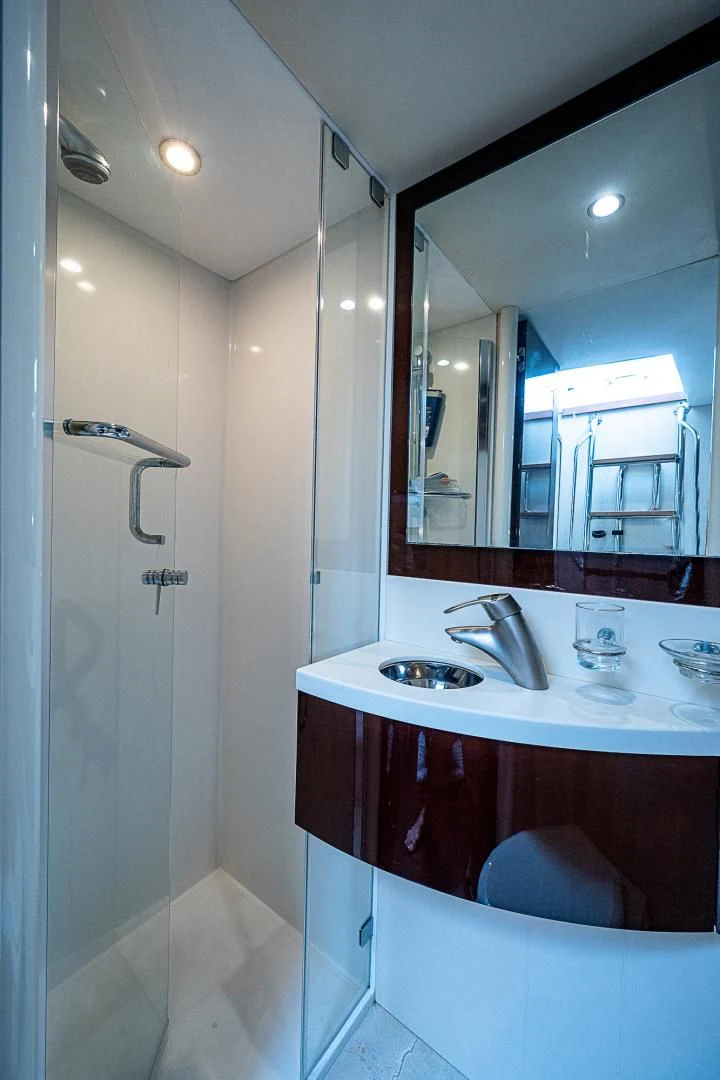 a bathroom with a shower and sink aboard LATITUDE Yacht for Sale