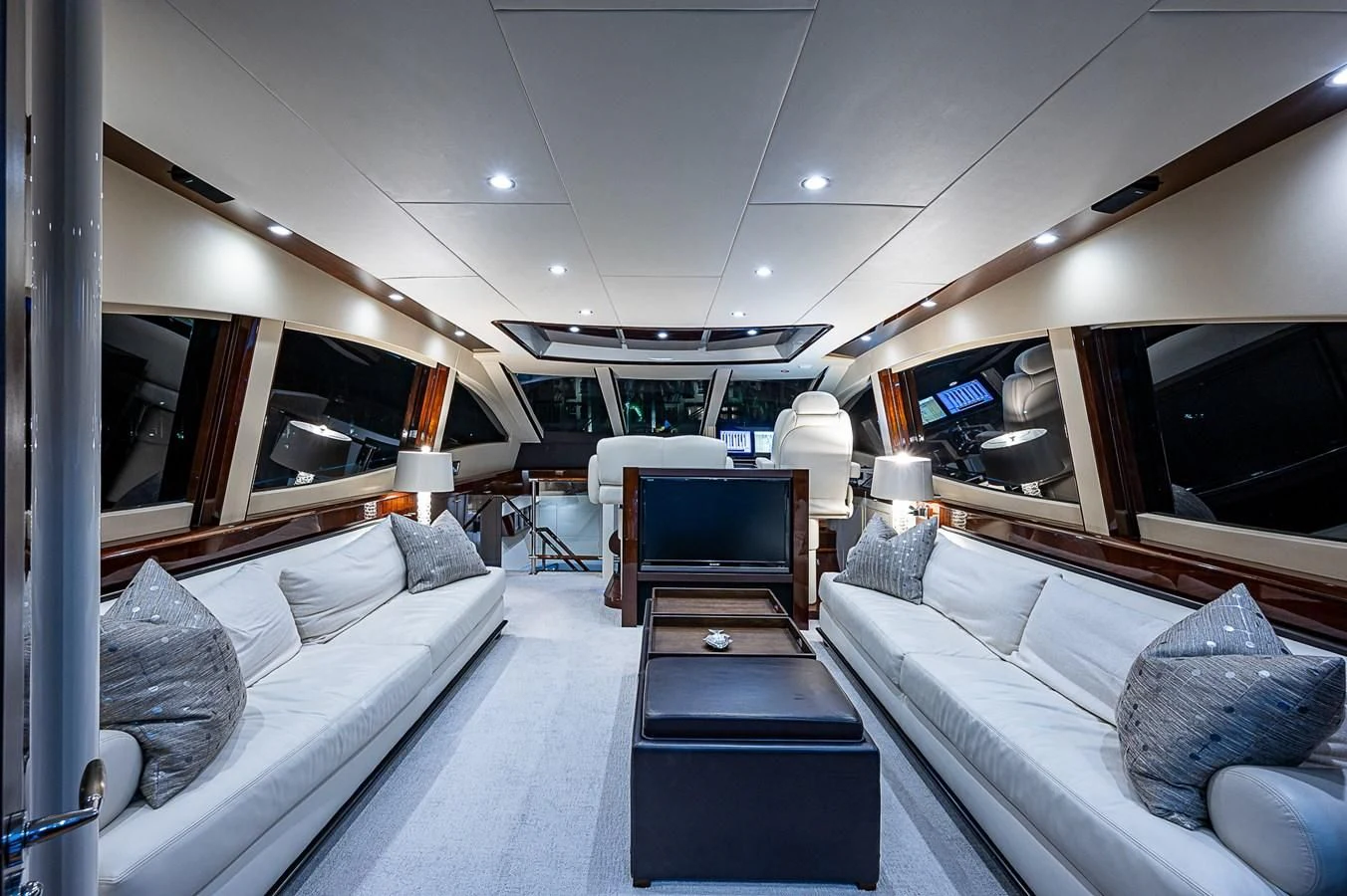 a room with a bed and a television aboard LATITUDE Yacht for Sale