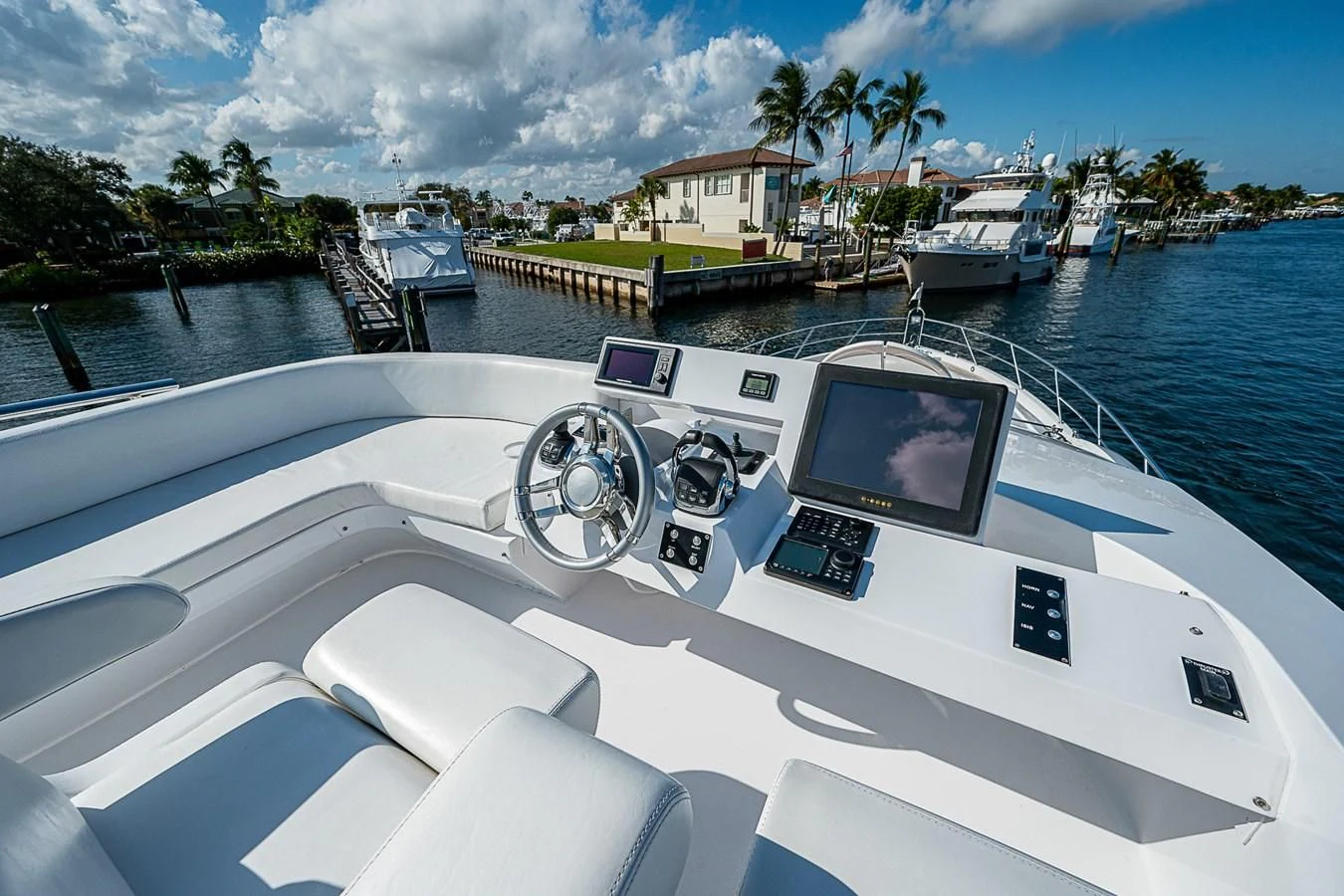 a boat with a steering wheel aboard LATITUDE Yacht for Sale