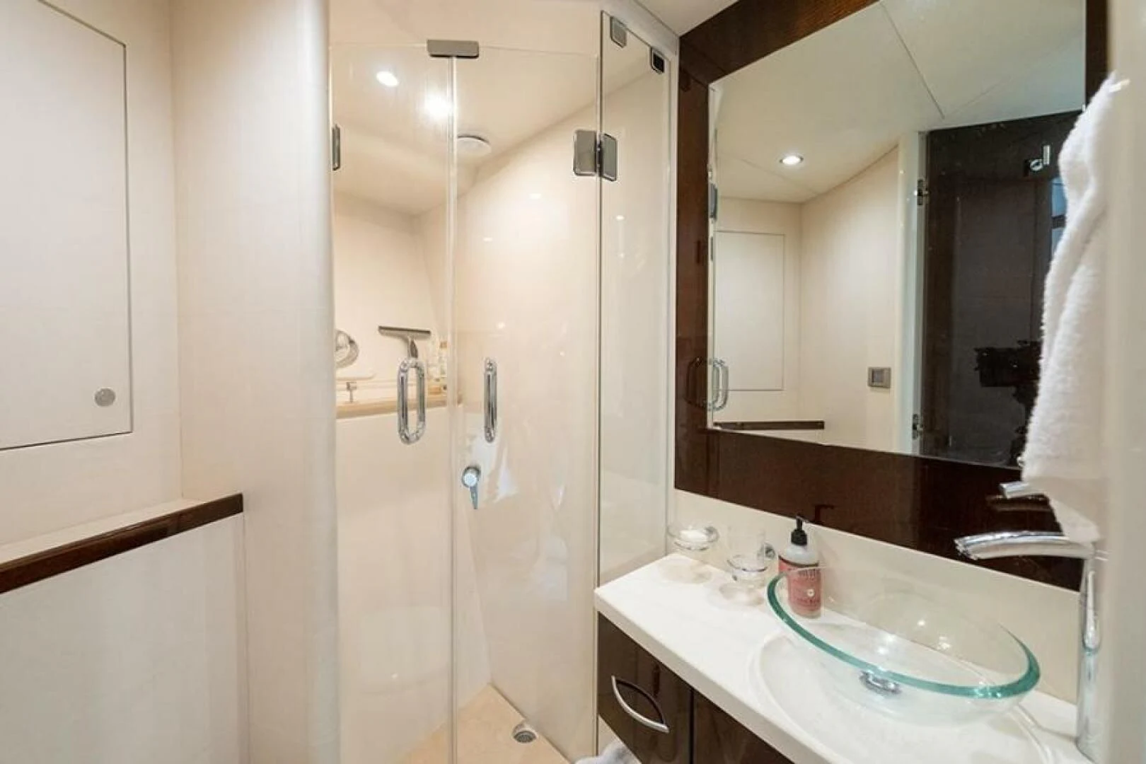 a bathroom with a large mirror aboard LATITUDE Yacht for Sale