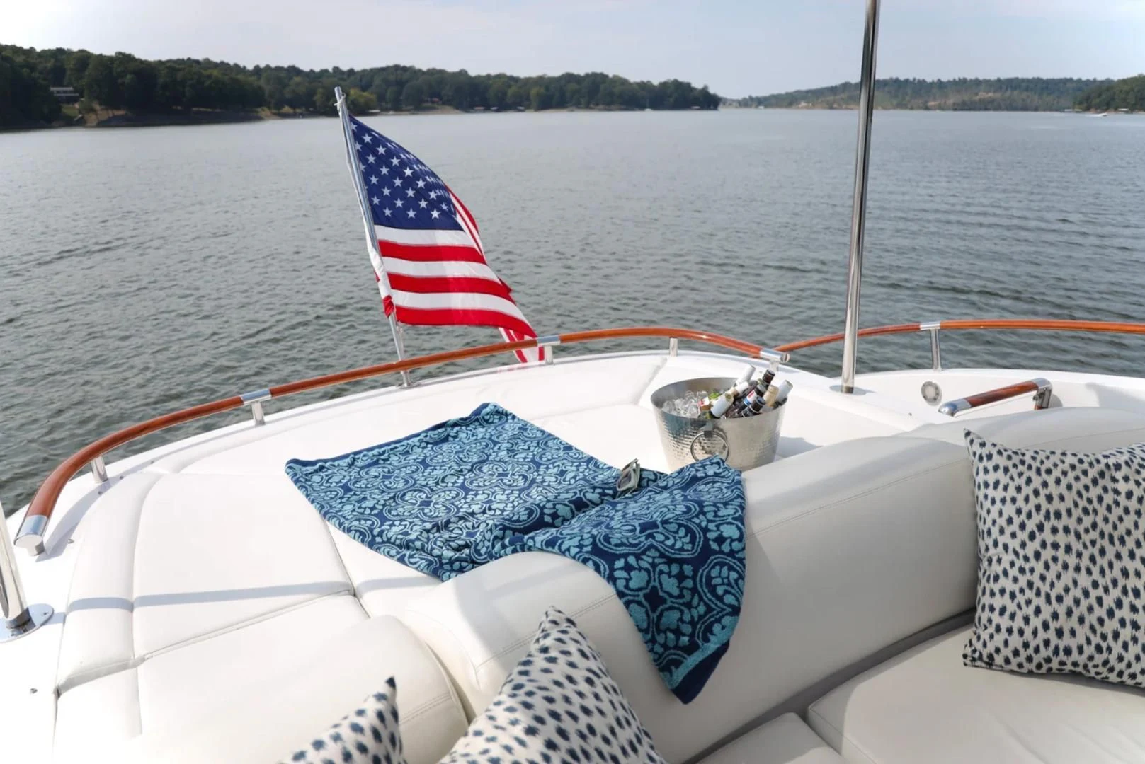 a boat with a flag on the front aboard LATITUDE Yacht for Sale