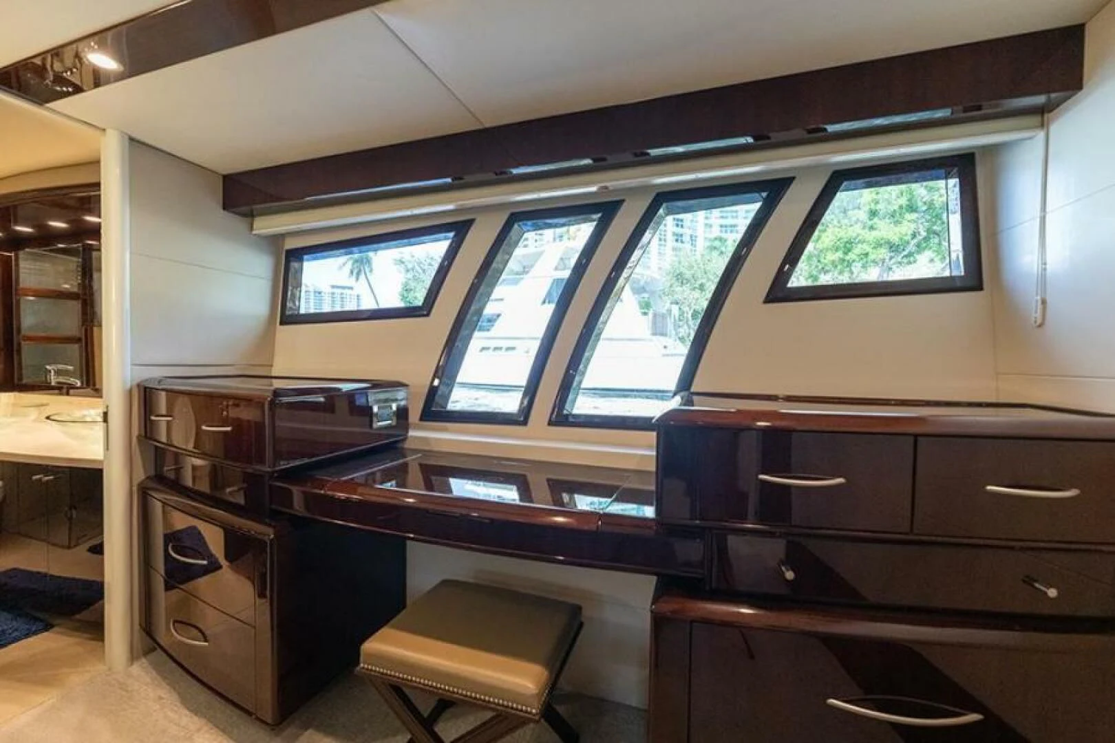 a room with a desk and a window aboard LATITUDE Yacht for Sale