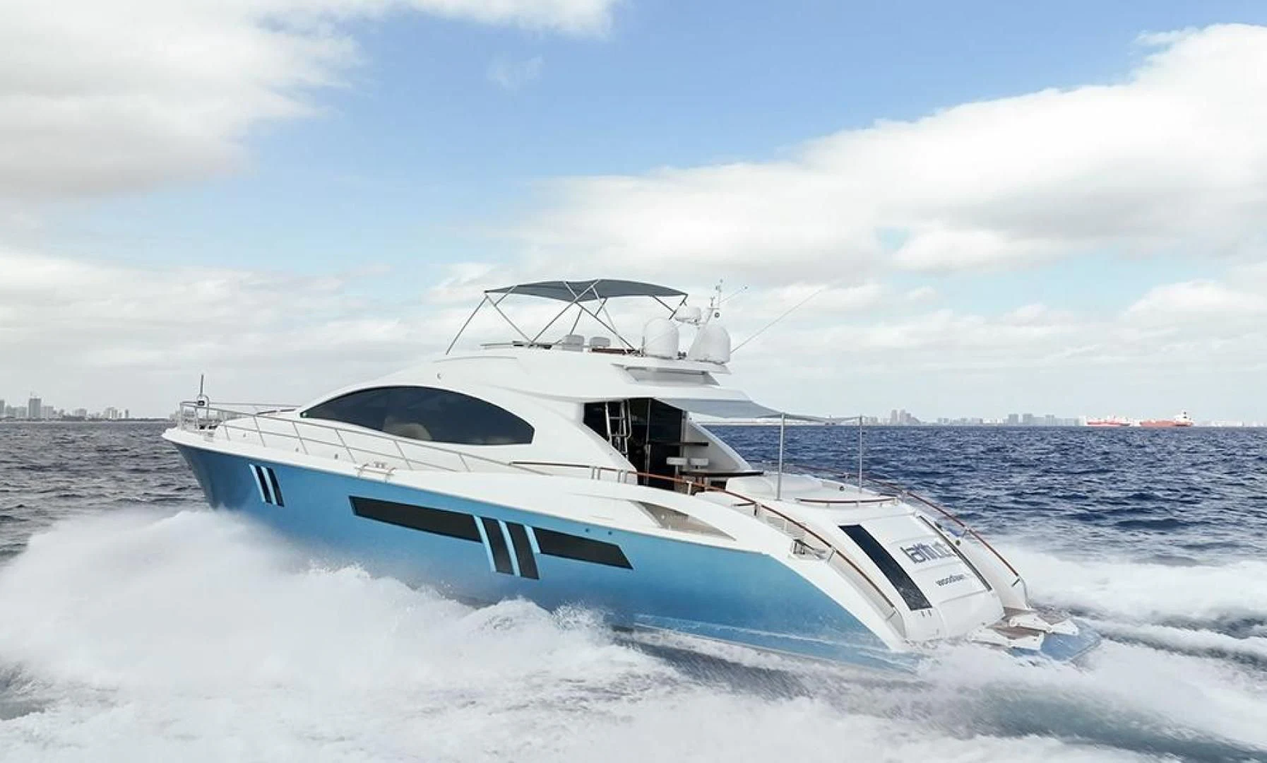 a white yacht on the water aboard LATITUDE Yacht for Sale