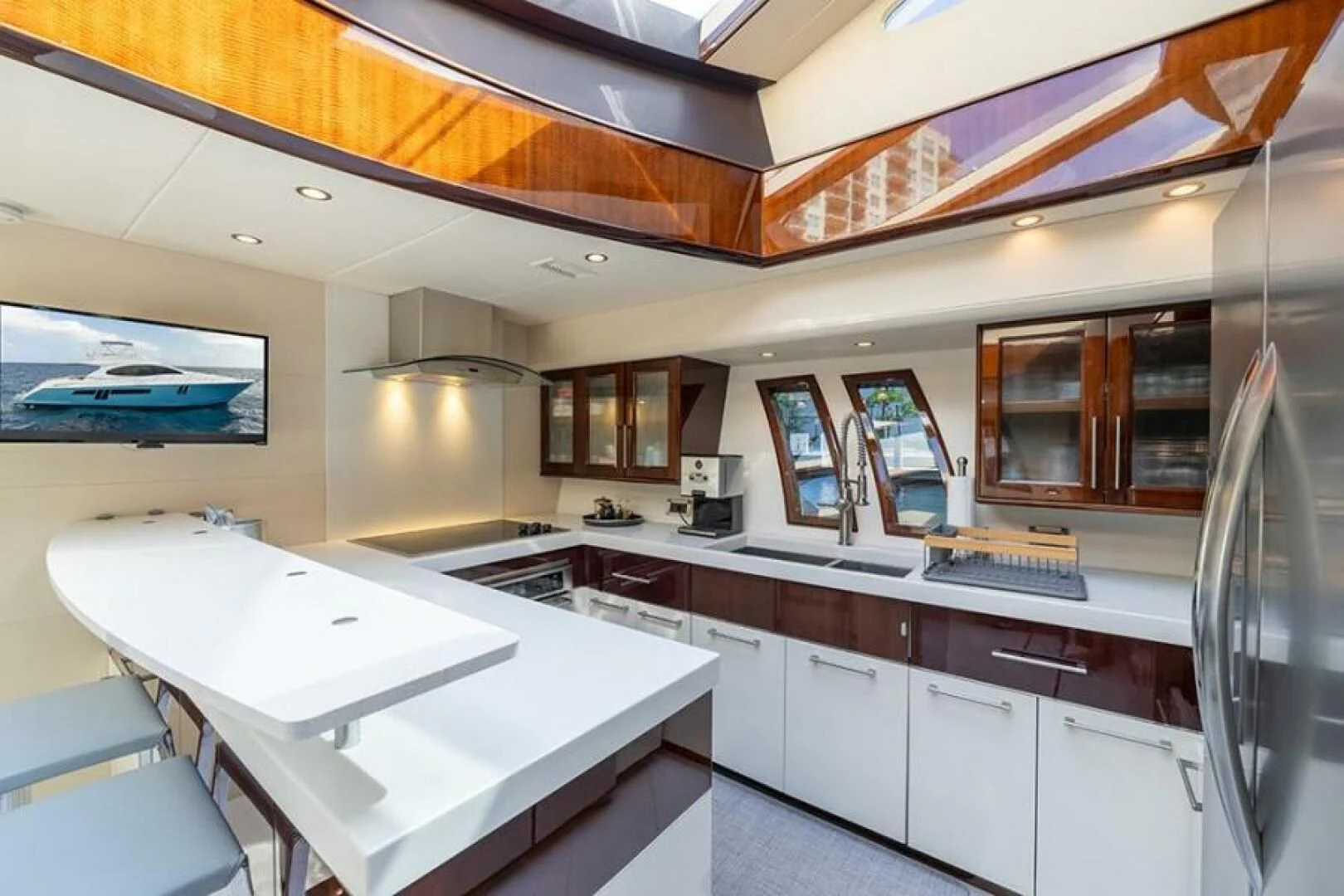 a kitchen with white cabinets aboard LATITUDE Yacht for Sale