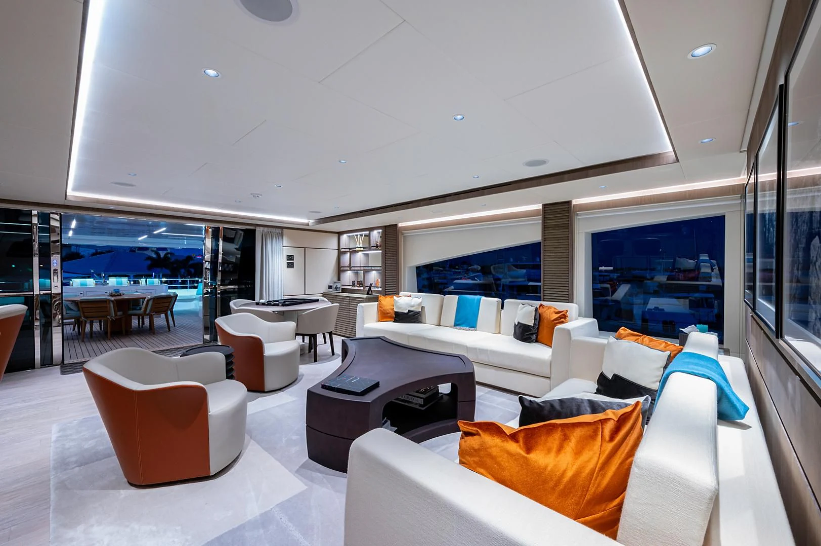 a room with a large window and a view of the ocean aboard LIRA Yacht for Sale