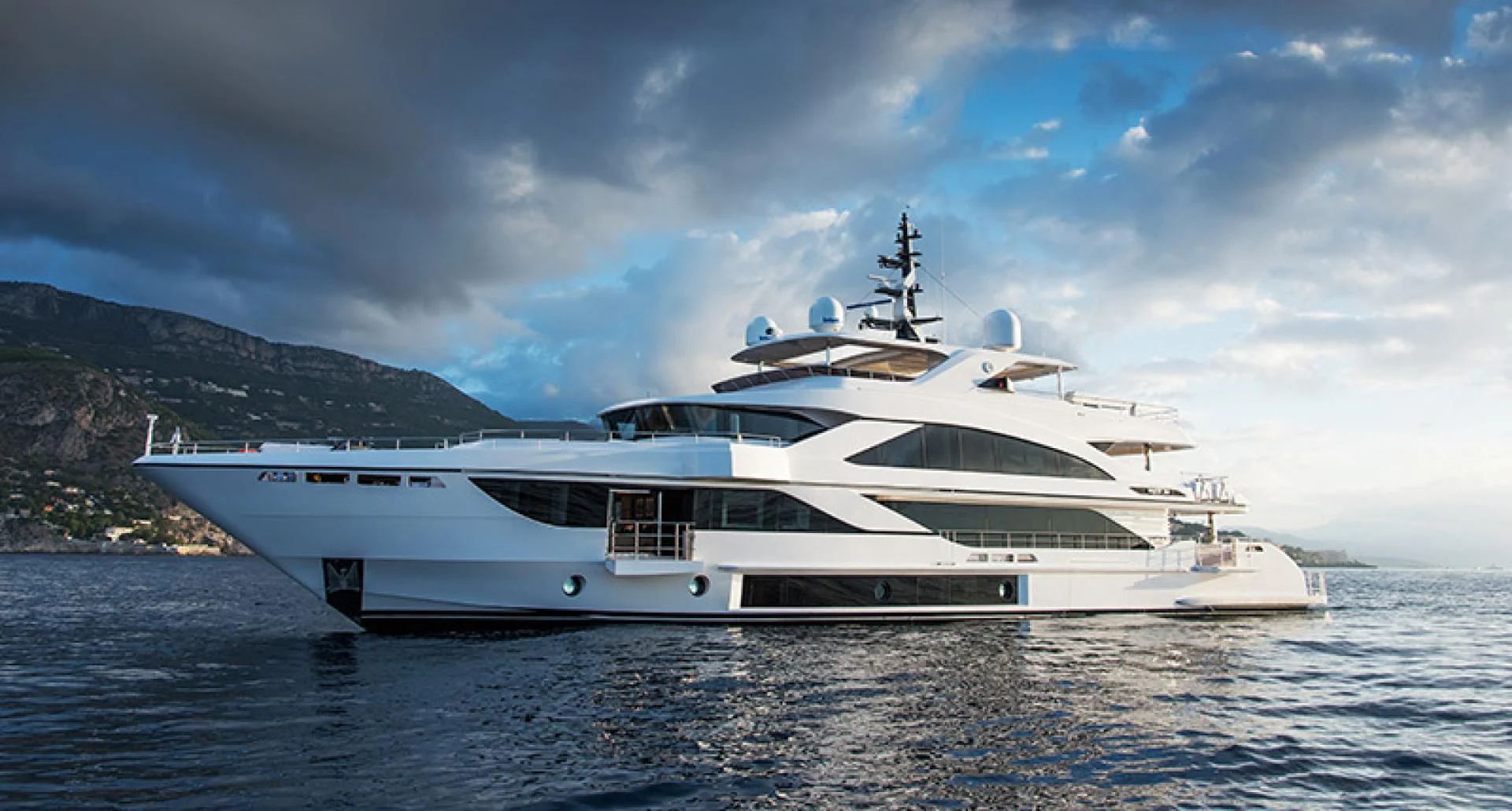 a white yacht on the water aboard LIRA Yacht for Sale