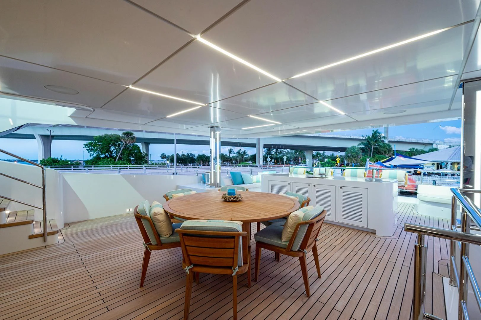 a table and chairs in a room aboard LIRA Yacht for Sale