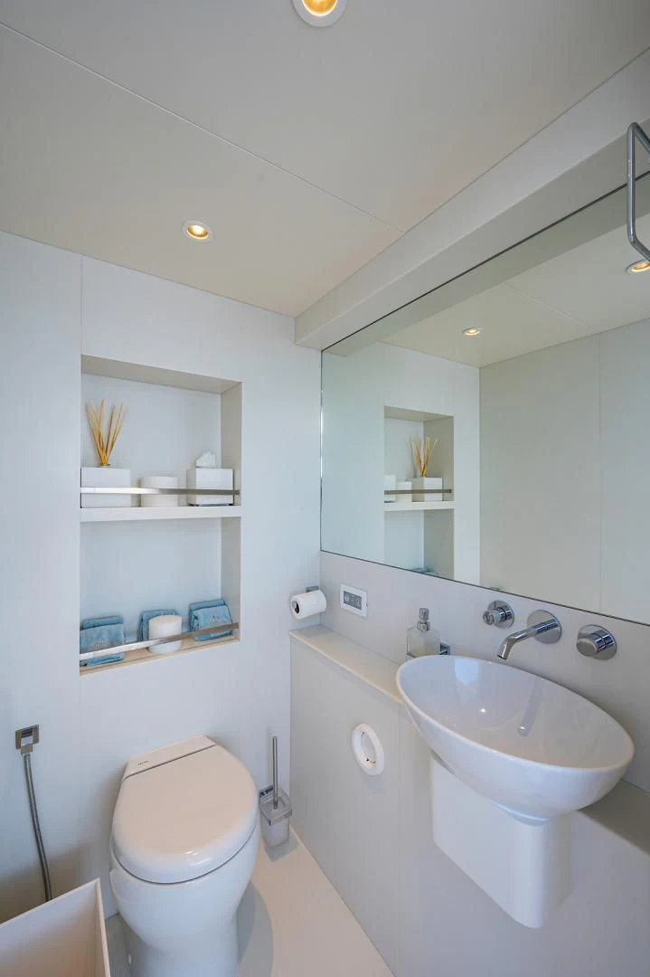 a bathroom with a sink and toilet aboard LIRA Yacht for Sale