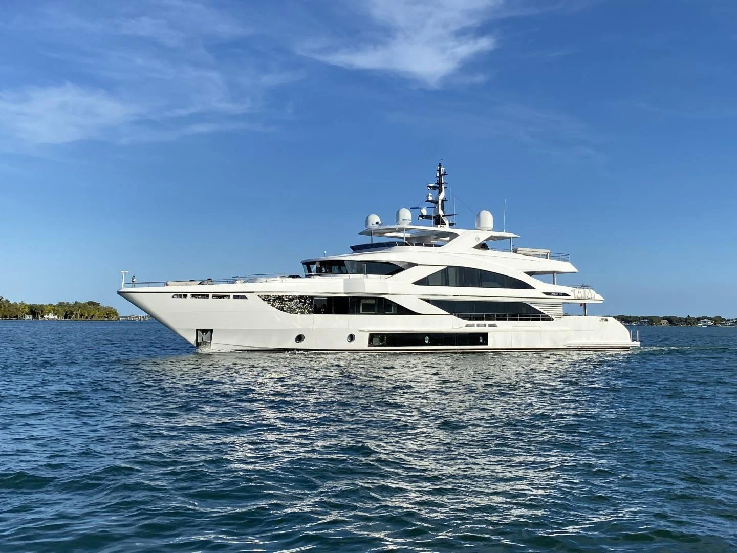 a white yacht on the water aboard LIRA Yacht for Sale