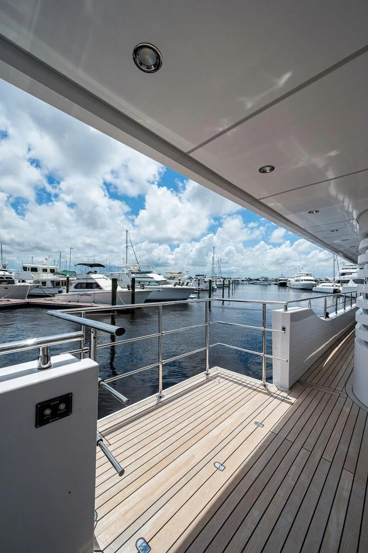 a deck with boats and a large body of water aboard LIRA Yacht for Sale