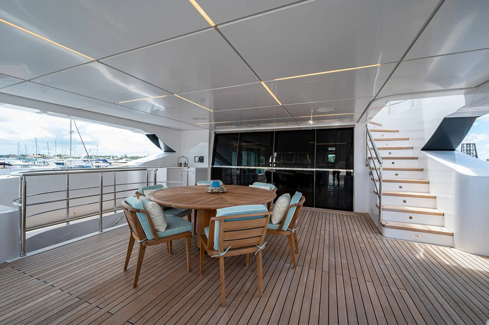 a room with a table and chairs aboard LIRA Yacht for Sale