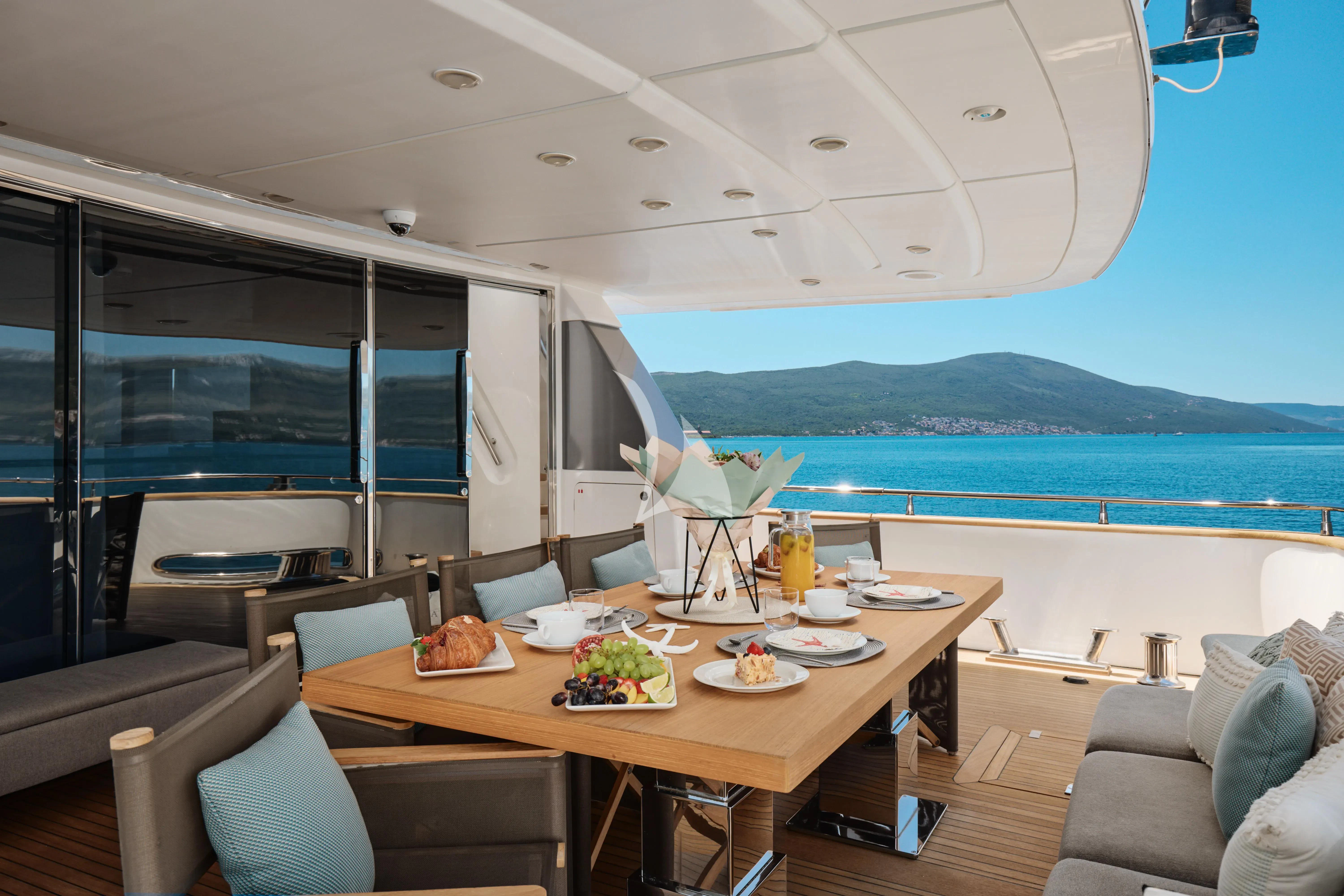 a table with food on it aboard PERTULA Yacht for Sale