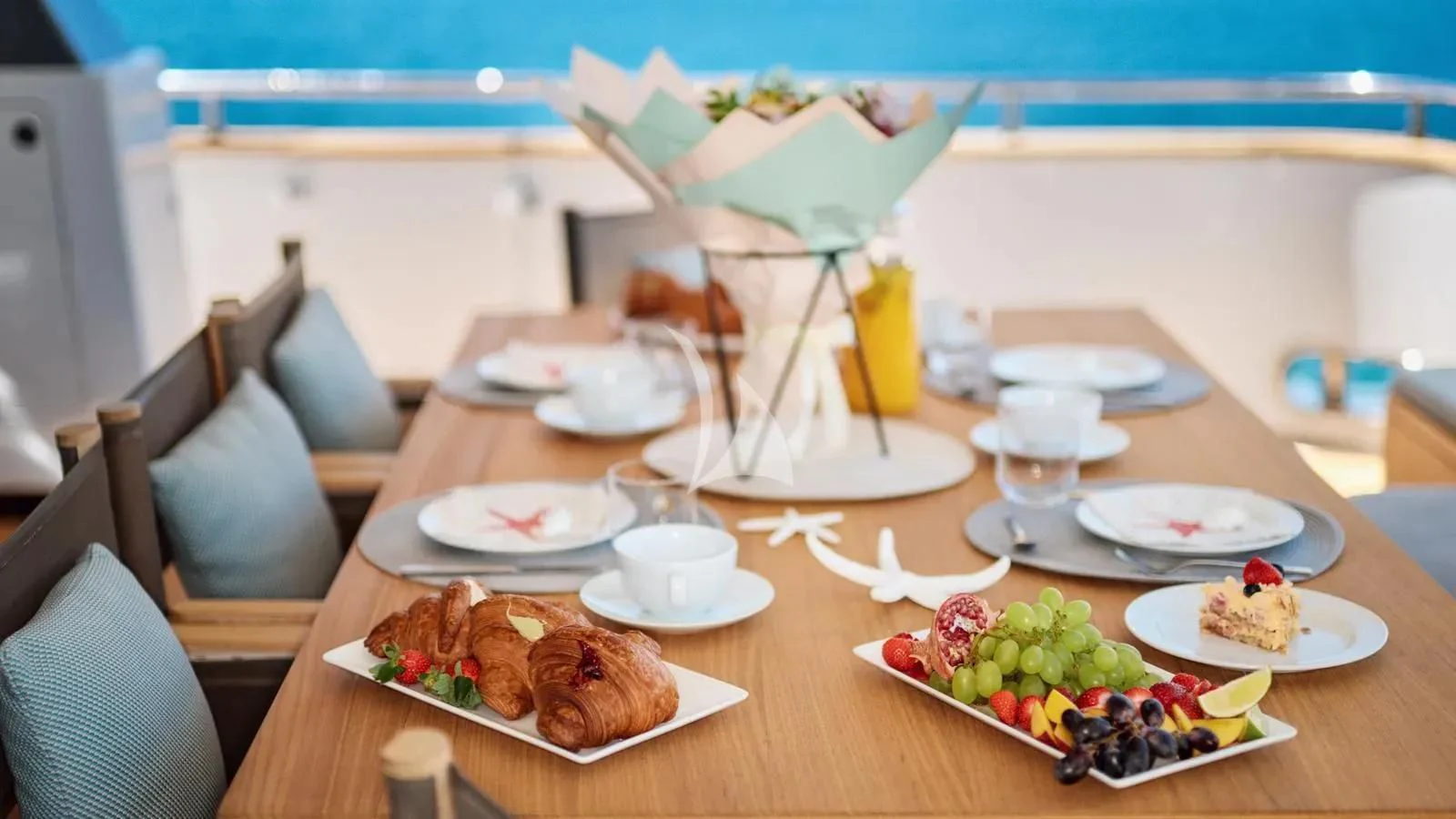a table with food on it aboard PERTULA Yacht for Sale