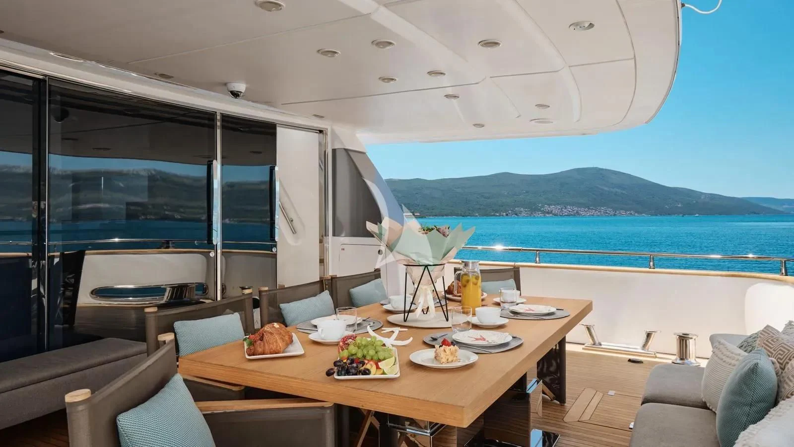 a table with food on it aboard PERTULA Yacht for Sale