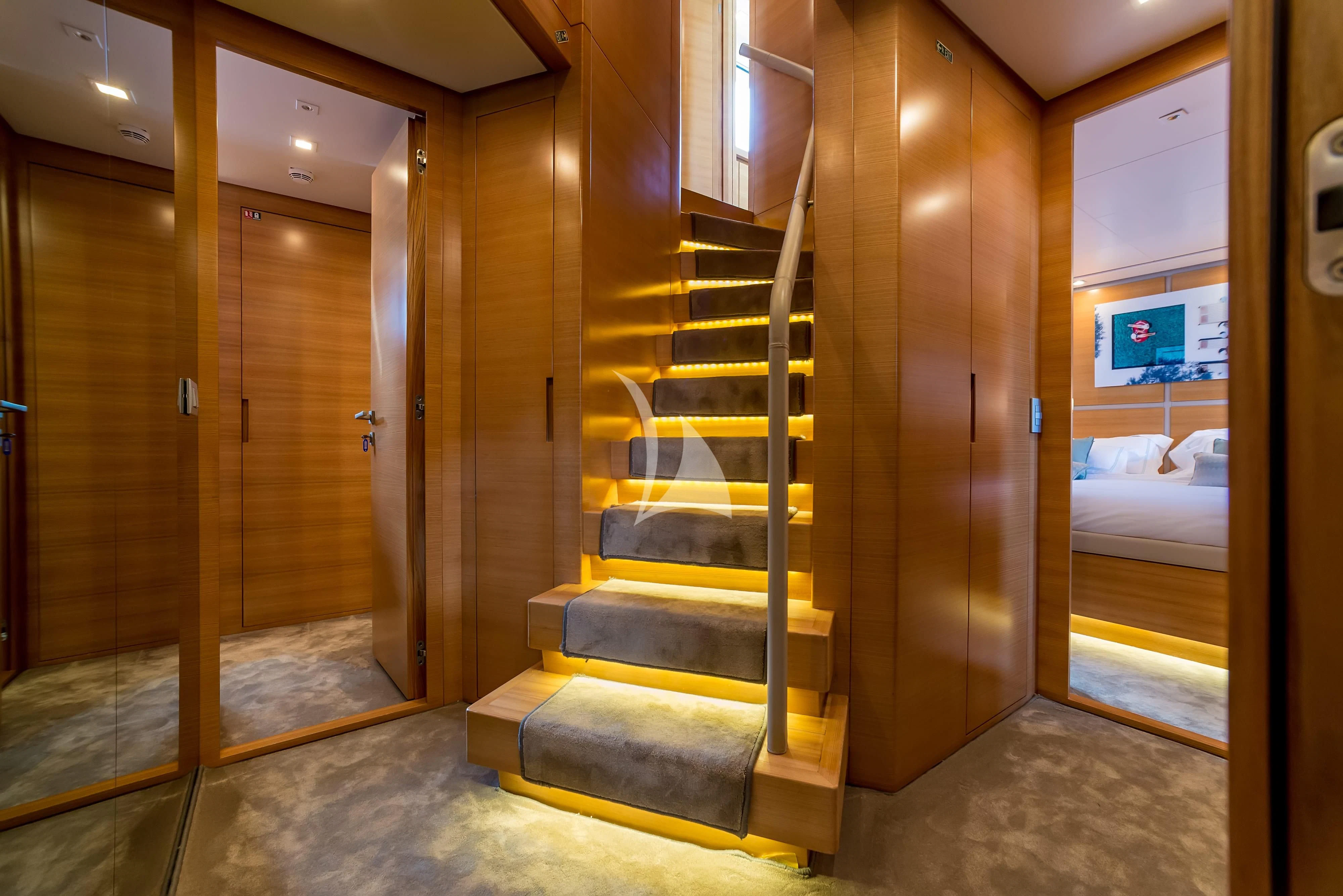 a wooden staircase in a room aboard PERTULA Yacht for Sale