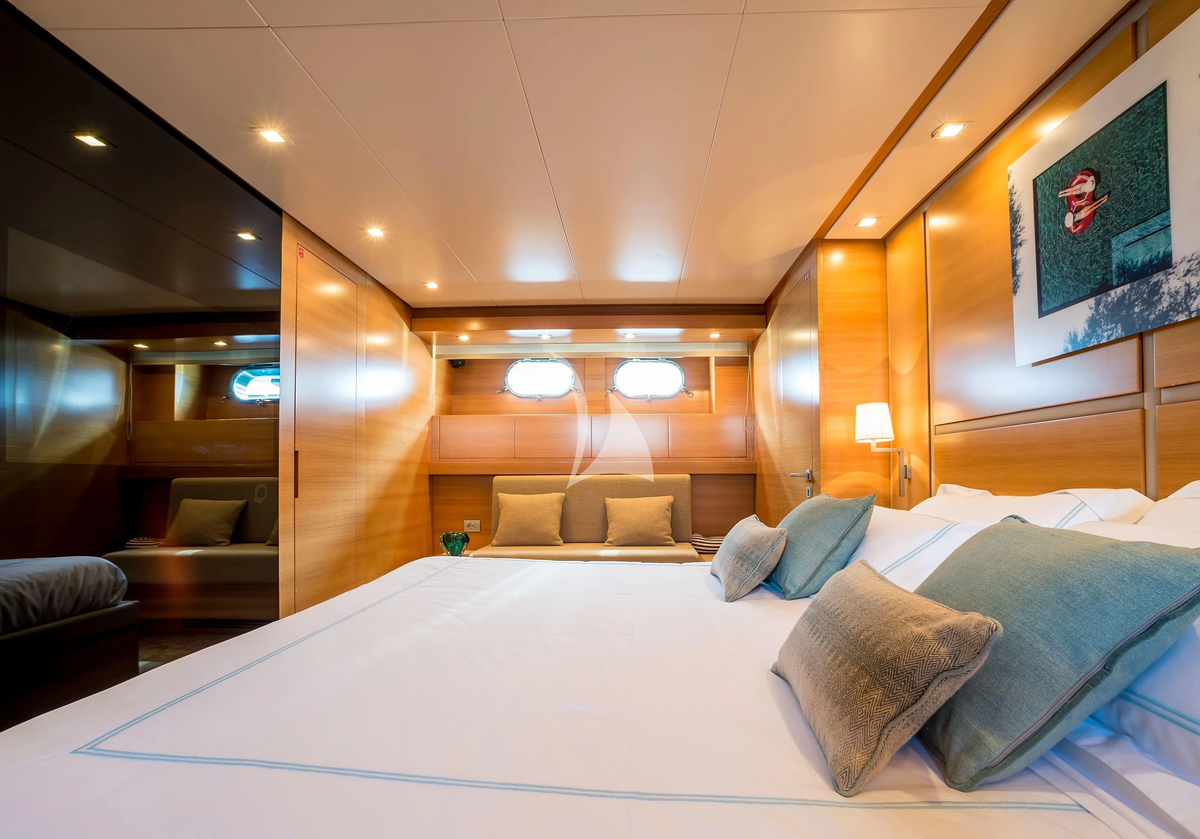 a large bed with pillows aboard PERTULA Yacht for Sale