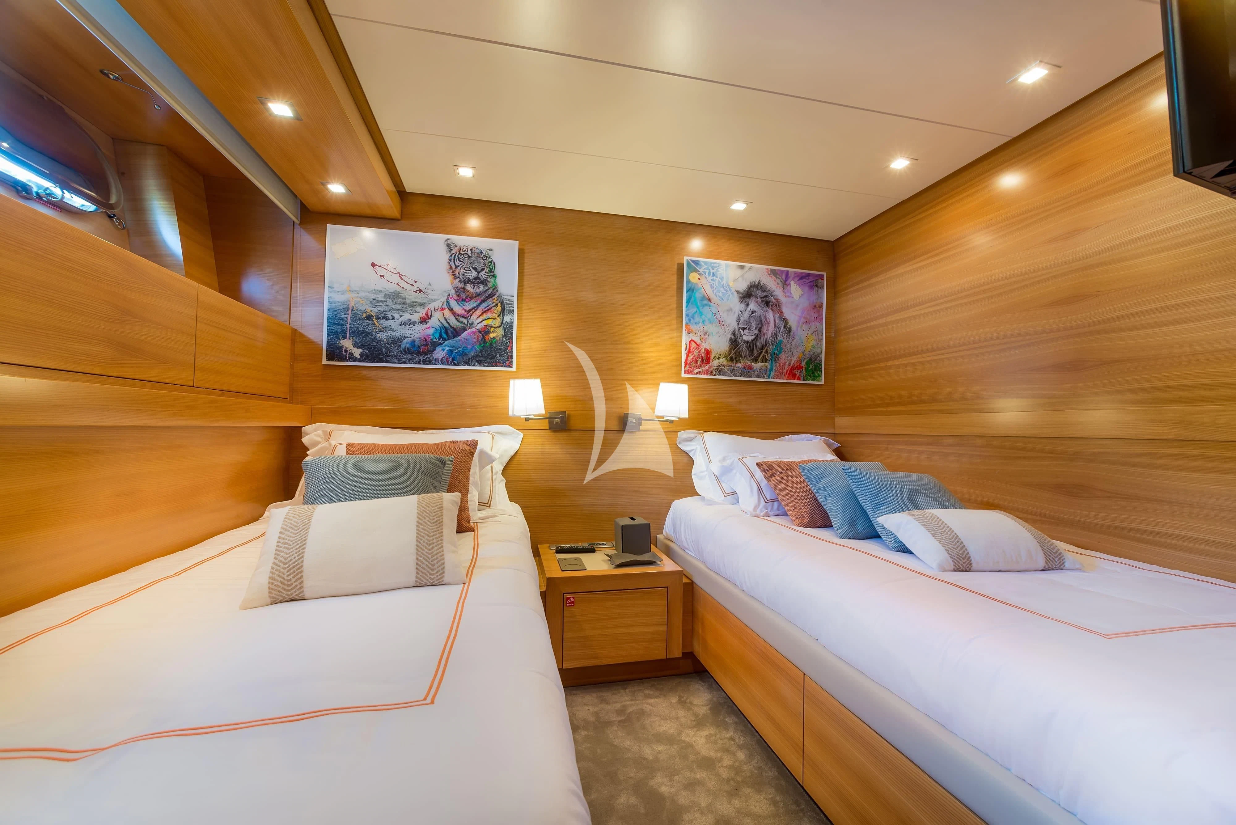 a room with two beds aboard PERTULA Yacht for Sale