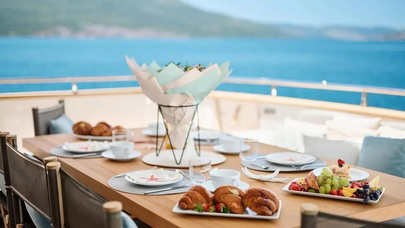 a table with food on it aboard PERTULA Yacht for Sale