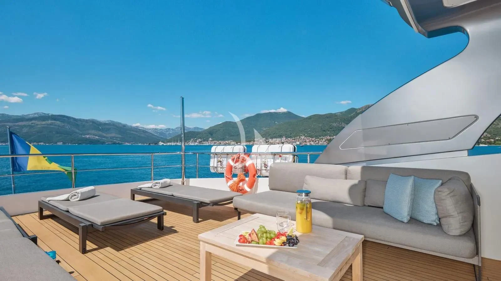 a tent with a fire pit and a table on a boat aboard PERTULA Yacht for Sale