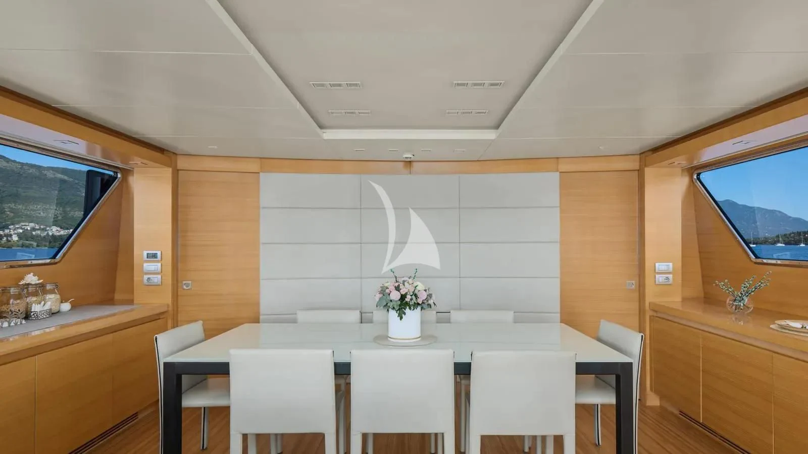 a room with a table and chairs aboard PERTULA Yacht for Sale