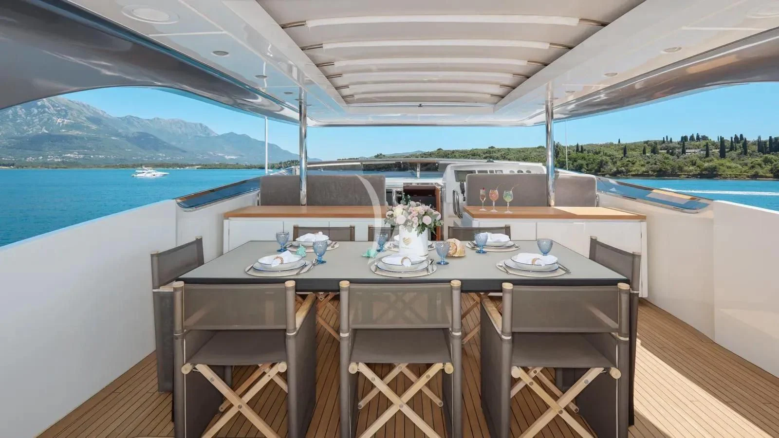 a table with chairs around it aboard PERTULA Yacht for Sale