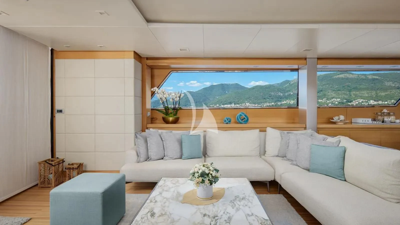 a living room with a large window aboard PERTULA Yacht for Sale