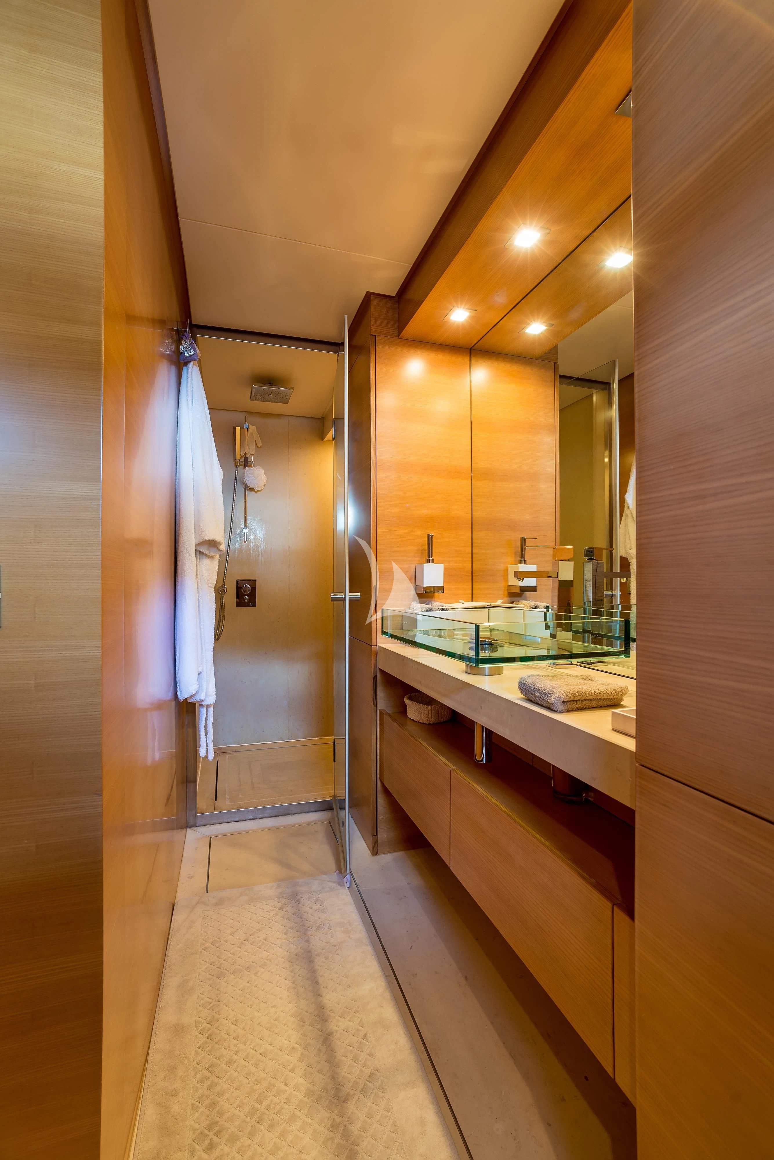a bathroom with a countertop sink and a mirror aboard PERTULA Yacht for Sale
